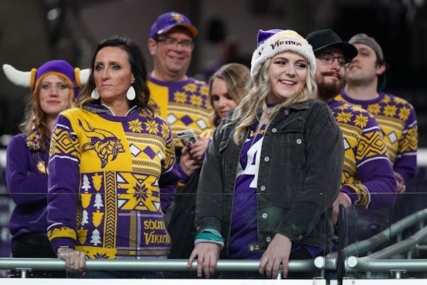 A family of Minnesota Vikings fans wore matching sweaters as they arrived at U.S. Bank Stadium for Monday night's game against the Green Bay Packers.