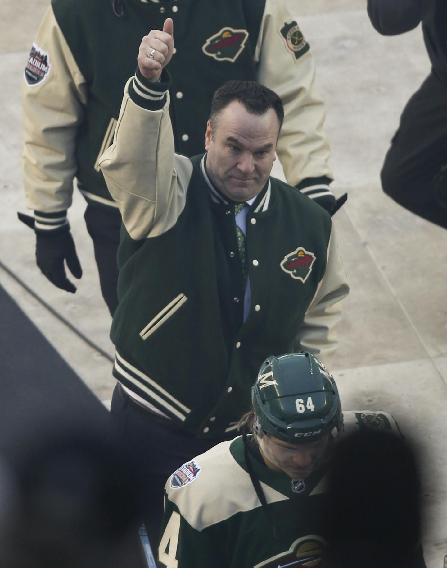 Wild head coach John Torchetti gave fans a thumbs up as he walked to the locker room after his fourth straight win since being named head coach. Behind him was assistant coach Andrew Brunette. ] JEFF WHEELER &#xef; jeff.wheeler@startribune.com The Minnesota Wild trounced the Chicago Blackhawks 6-1 in the 2016 NHL Stadium Series outdoor game Sunday afternoon, February 21, 2016 at TCF Bank Stadium in Minneapolis.