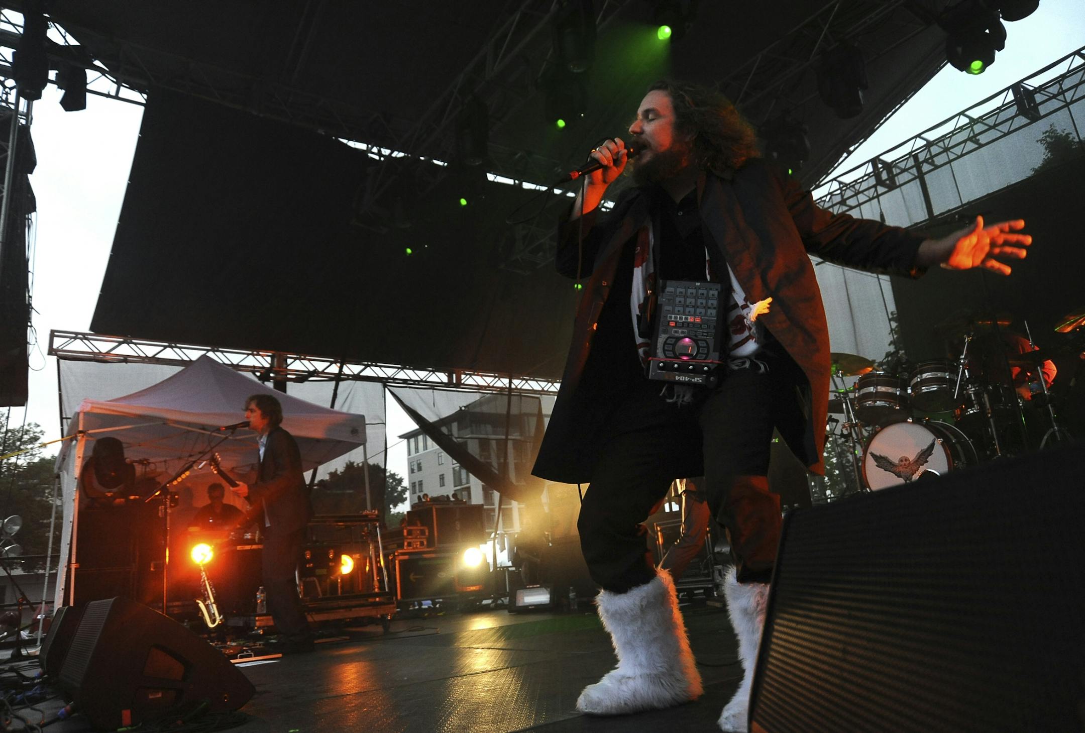My Morning Jacket's lead singer, Jim James performed during Rock the Garden music festival at the Walker Art Center. Despite rainy weather, thousands of people turned up to enjoy a variety of bands.