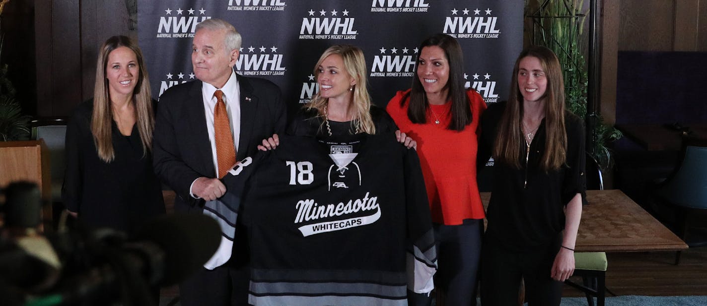 Gov. Mark Dayton posed for a photo with, from left, Whitecaps captain Winny Brodt Brown, league founder and commissioner Dani Rylan, and deputy commissioner Hayley Moore following the announcement. ] ANTHONY SOUFFLE &#xef; anthony.souffle@startribune.com Officials with the National Women's Hockey League held a press conference to announce they had acquired the Minnesota Whitecaps Tuesday, May 15, 2018 at Herbie's on the Park in St. Paul, Minn.