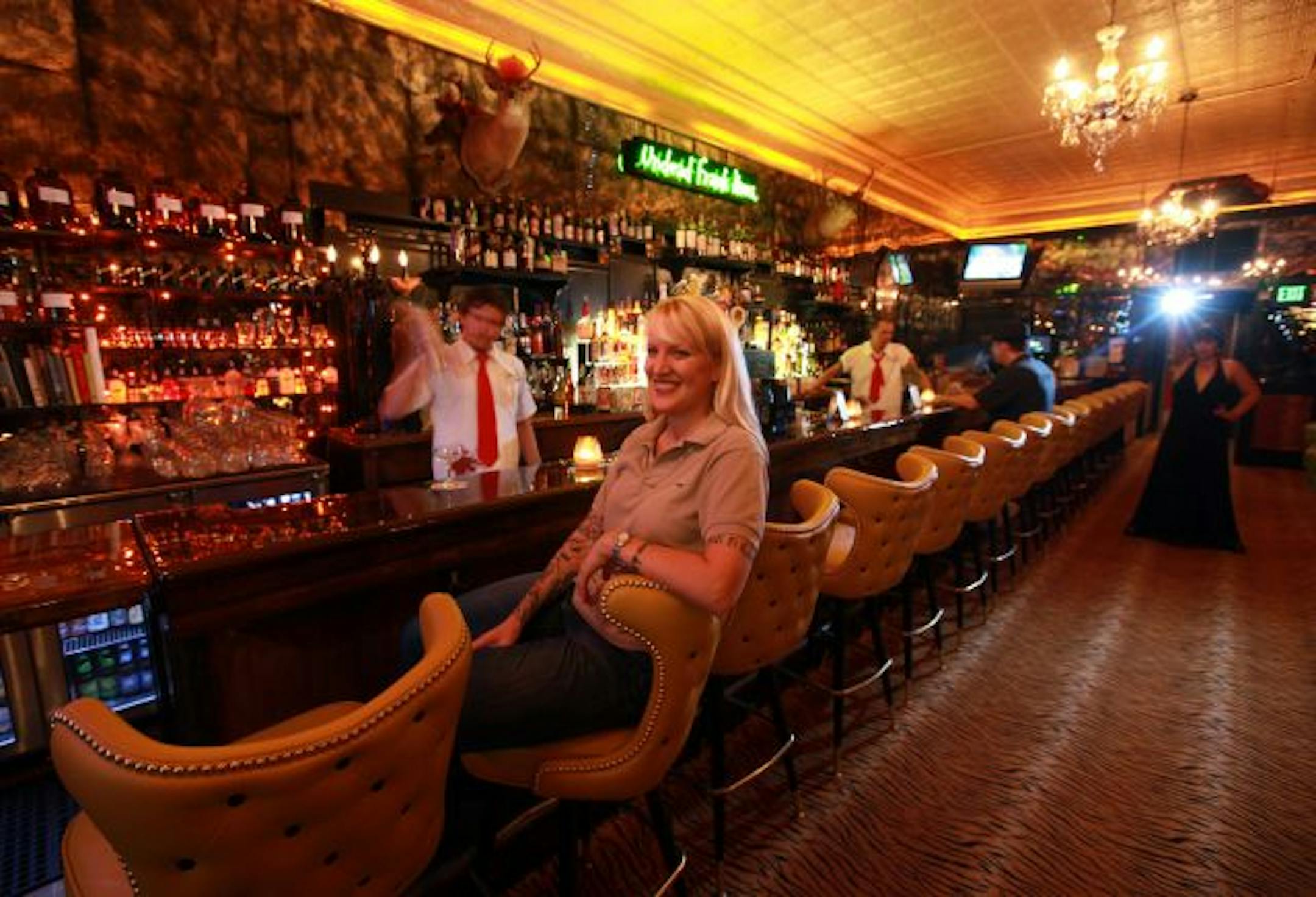 Owner Leslie Bock sits at the bar early on a Saturday night.