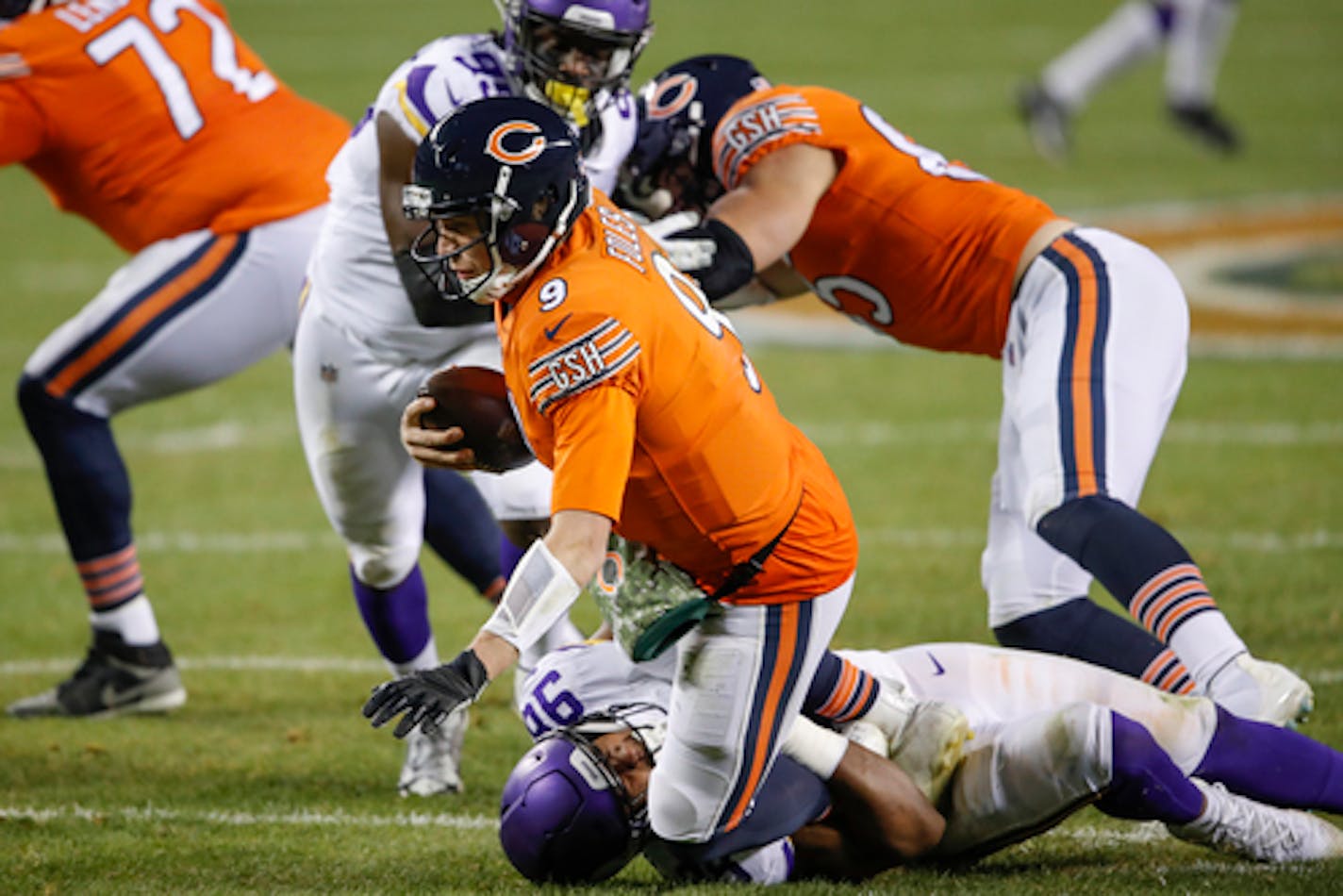 Chicago Bears quarterback Nick Foles (9) is sacked by Minnesota Vikings defensive end D.J. Wonnum (98) during the second half of an NFL football game, Monday, Nov. 16, 2020, in Chicago. (AP Photo/Kamil Krzaczynski) ORG XMIT: NYOTK