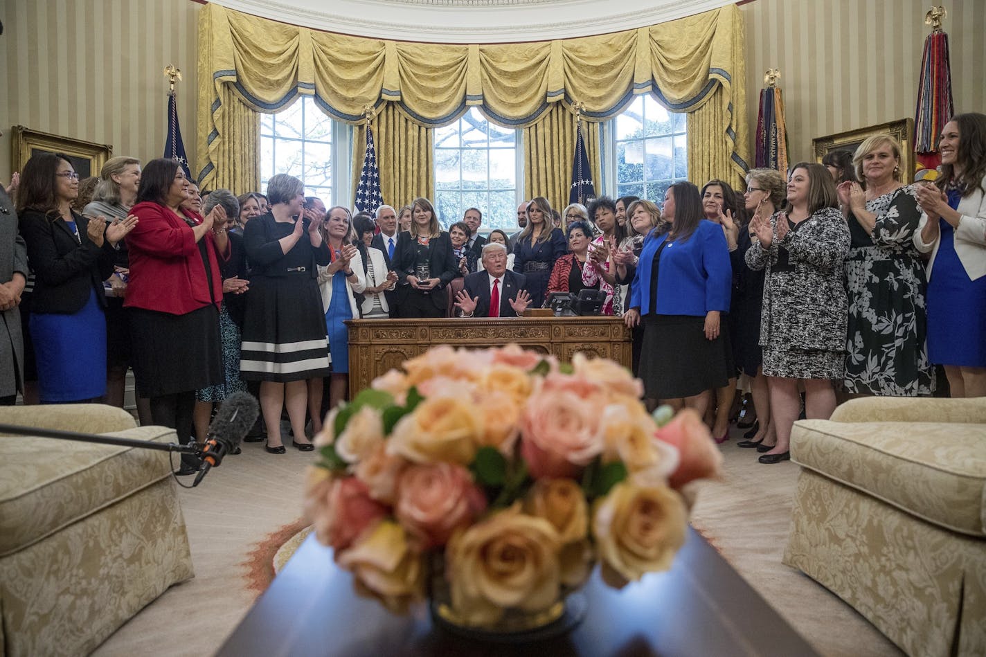 President Donald Trump, center, speaks at a National Teacher of the Year event in the Oval Office at the White House in Washington, Wednesday, April 26, 2017. (AP Photo/Andrew Harnik)