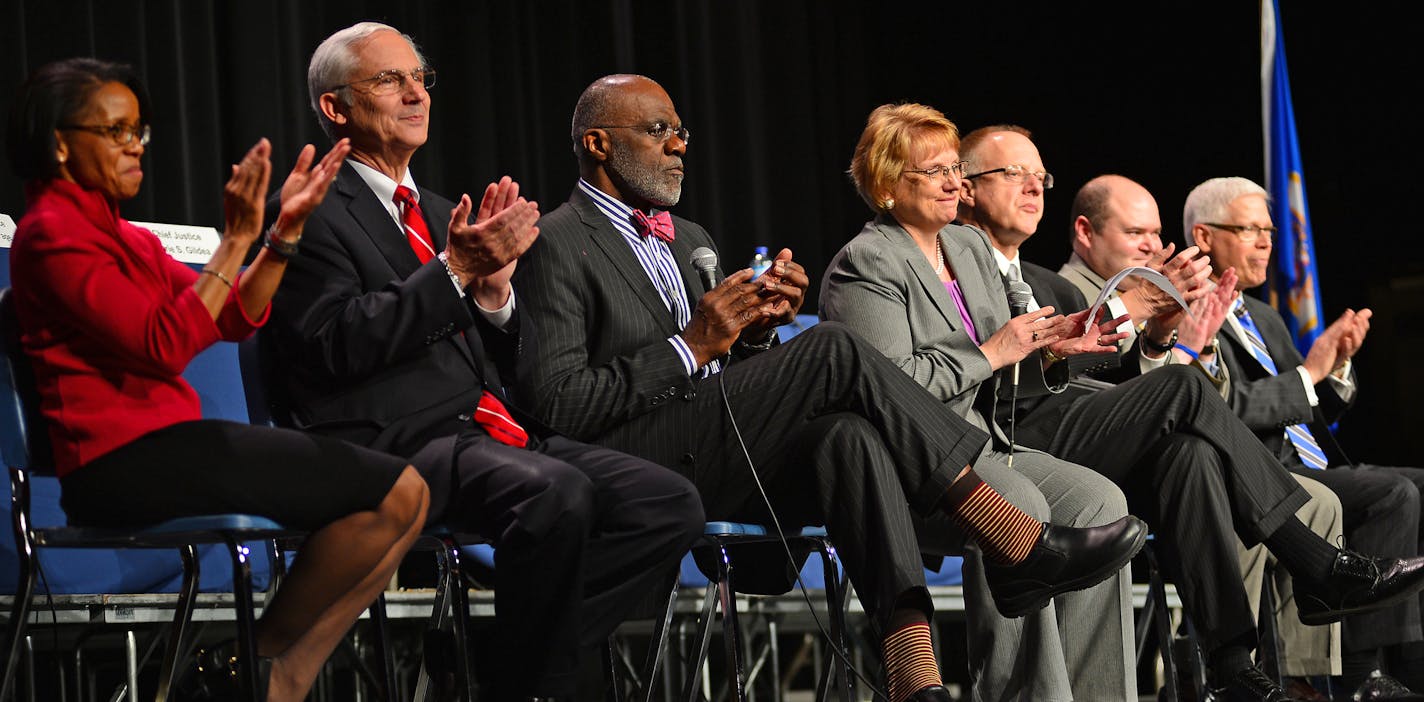 The Supreme Court Justices appluaded the students and faculty during a question and answer period at Champlin Park High School.