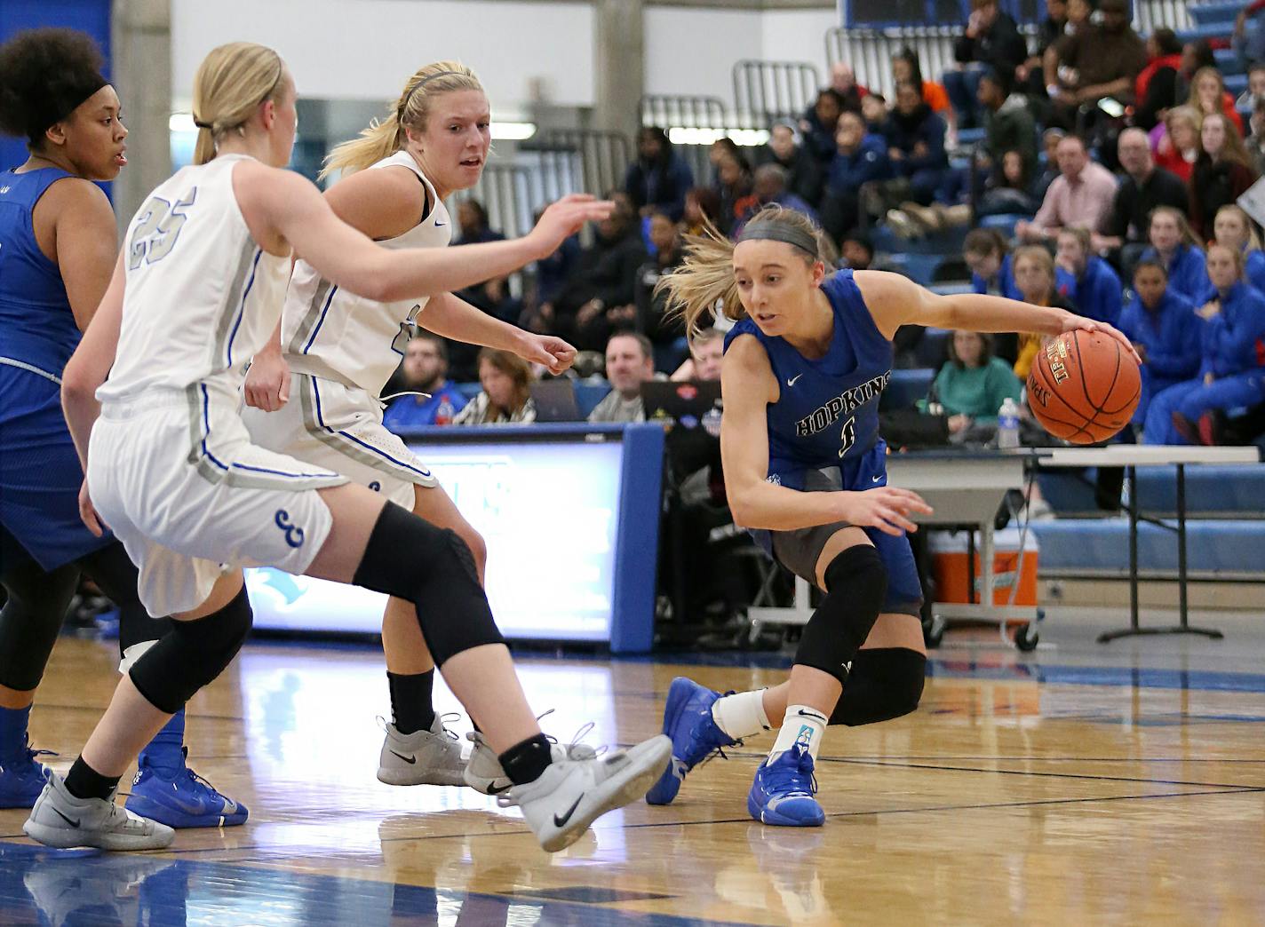 Hopkins Paige Bueckers (1) works her way past two Eastview defenders. The Royals cruised to a 75-48 over the Lightning on Saturday night earning a 4-0 start to their season. Photo by Cheryl Myers, SportsEngine