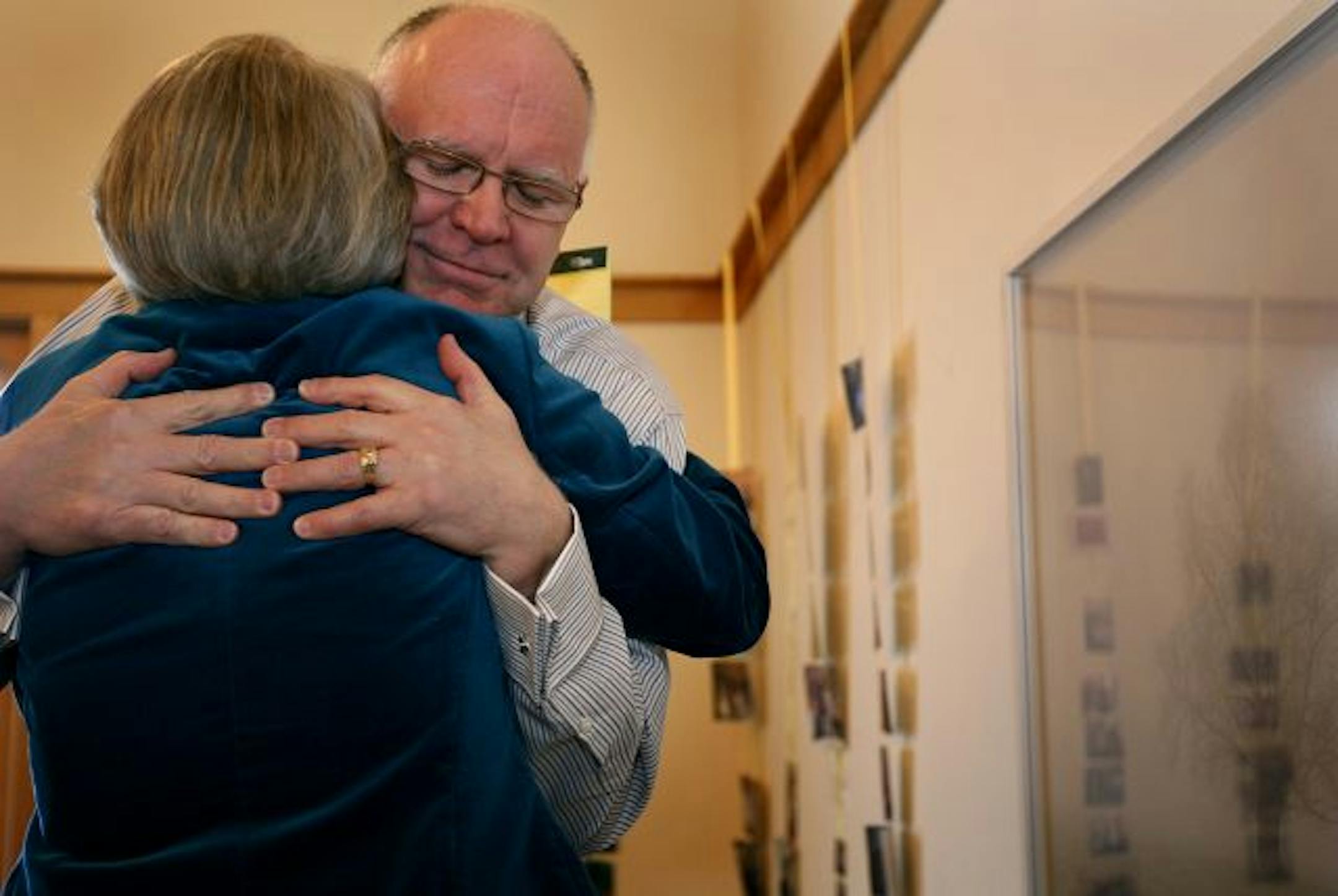 Howard Bell was hugged at a celebration honoring his retirement at Pathways in Minneapolis on Sunday.