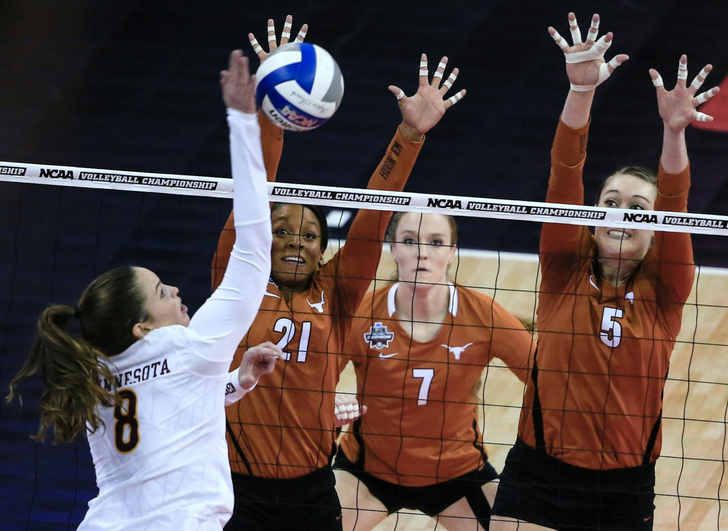 The Gophers&#x2019; Sarah Wilhite tried to spike the ball past the outreached hands of Texas&#x2019; Chloe Collins (21) and Molly McCage.