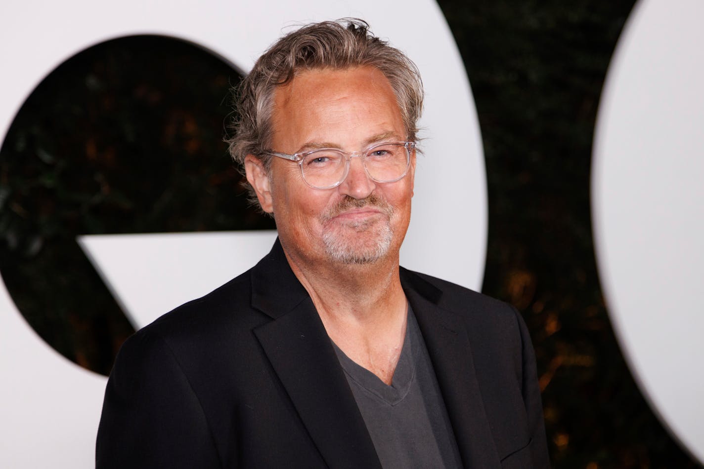 FILE - Matthew Perry arrives at the GQ Men of the Year Party on Thursday, Nov.17, 2022, in West Hollywood, Calif. Perry, who starred as Chandler Bing in the hit series "Friends," has died. He was 54. The Emmy-nominated actor was found dead of an apparent drowning at his Los Angeles home on Saturday, according to the Los Angeles Times and celebrity website TMZ, which was the first to report the news. Both outlets cited unnamed sources confirming Perry's death. His publicists and other representatives did not immediately return messages seeking comment. (Photo by Willy Sanjuan/Invision/AP, File)