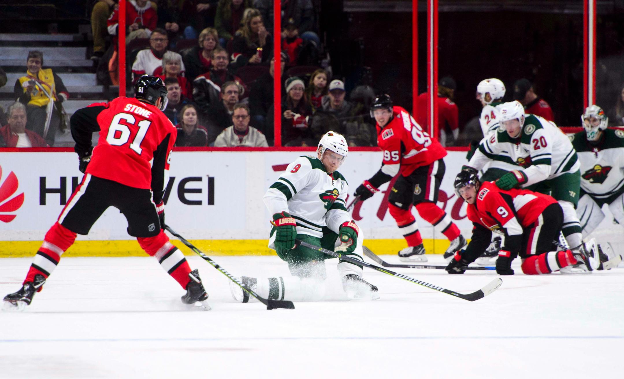 Minnesota Wild's Mikko Koivu attempts to block a shot from Ottawa Senators' Mark Stone during first period NHL hockey action in Ottawa on Tuesday, Dec. 19, 2017. (Sean Kilpatrick/The Canadian Press via AP)