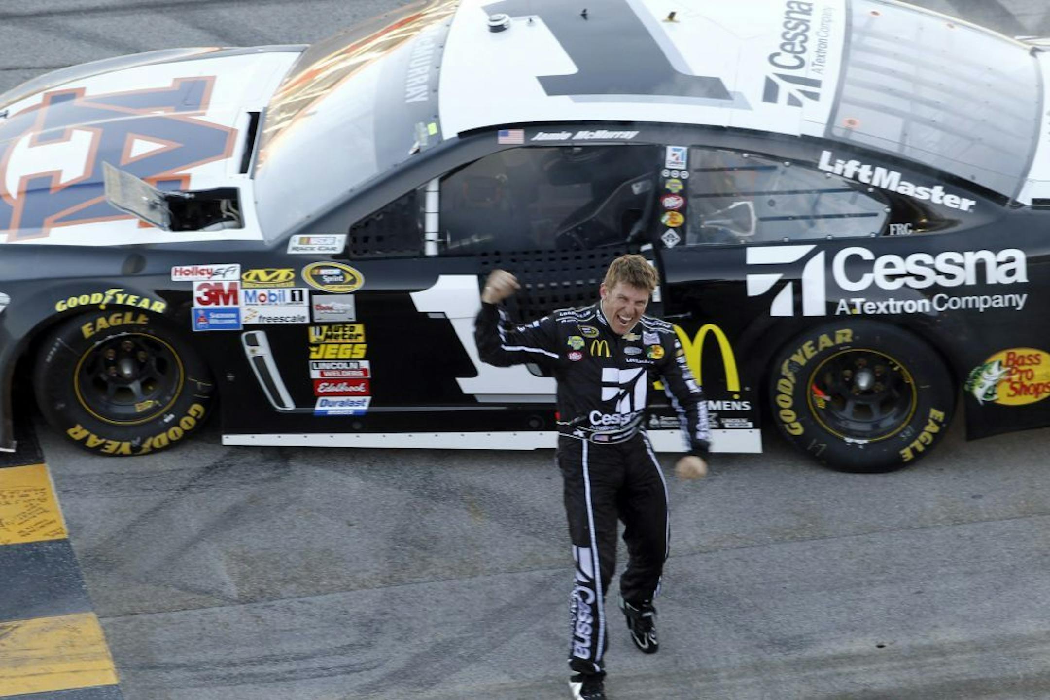 Sprint Cup Series driver Jamie McMurray (1) celebrated after winning the NASCAR Sprint Cup Series auto race at the Talladega (Ala.) Superspeedway on Sunday.