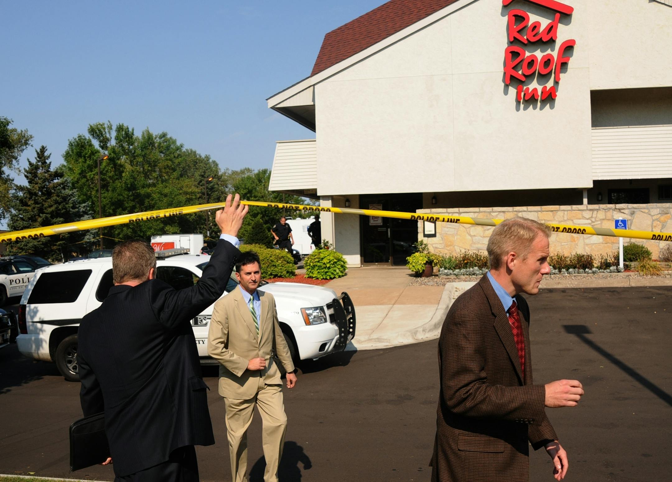 A standoff with police involving numerous hostages at a Red Roof Inn near Interstate 494 and Valley Creek Road early Friday left one man shot to death by police and another under arrest, authorities said. l to r Woodbury Police Chief Lee Vague and BCA Senior Special Agent Drew Evans walked to a 10:30 press conference