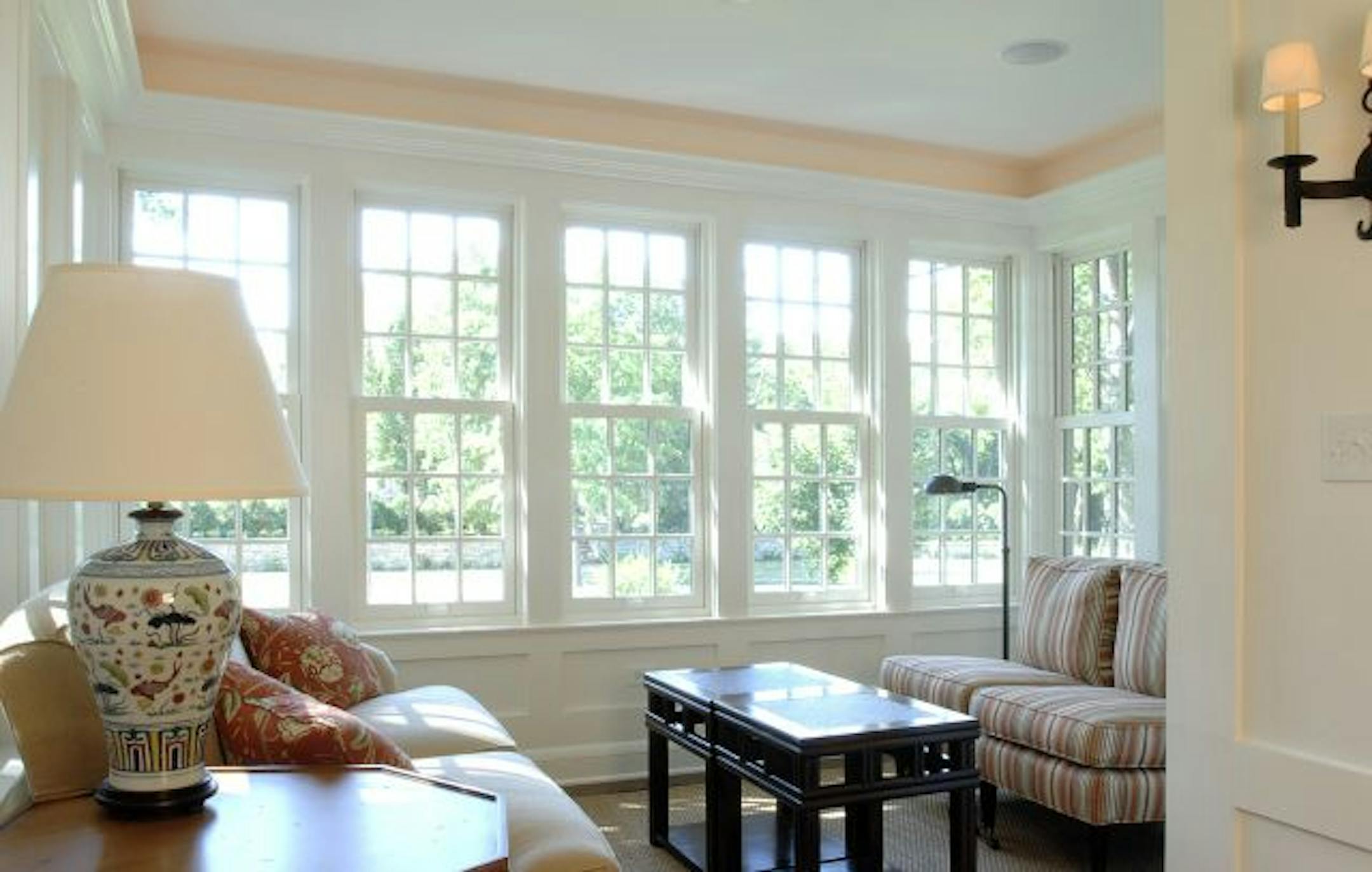 The sunroom blends so seamlessly it looks as if it were original to the 1920s house.