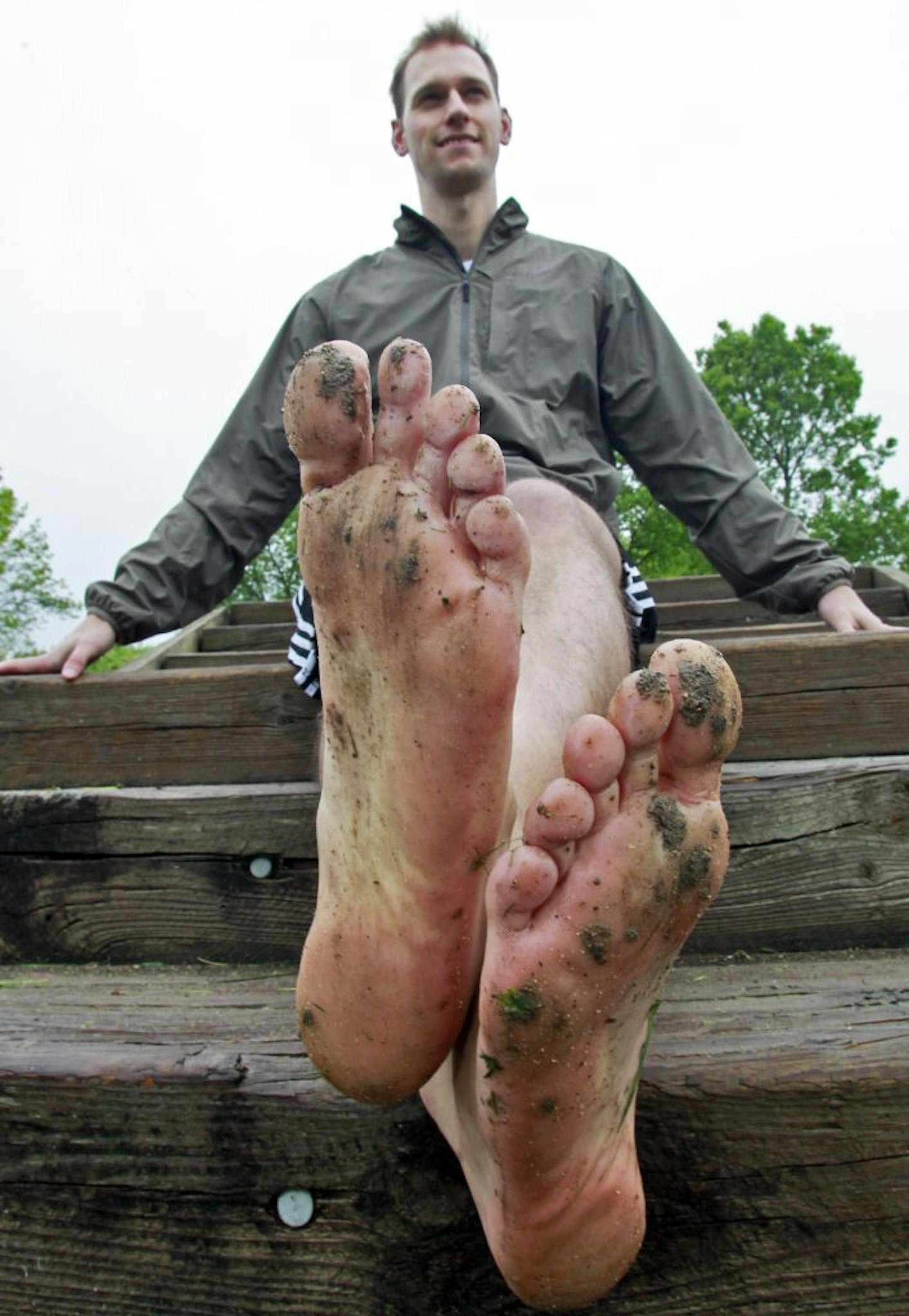 Christian Peterson takes a break after running the trails of Weaver Lake Park.