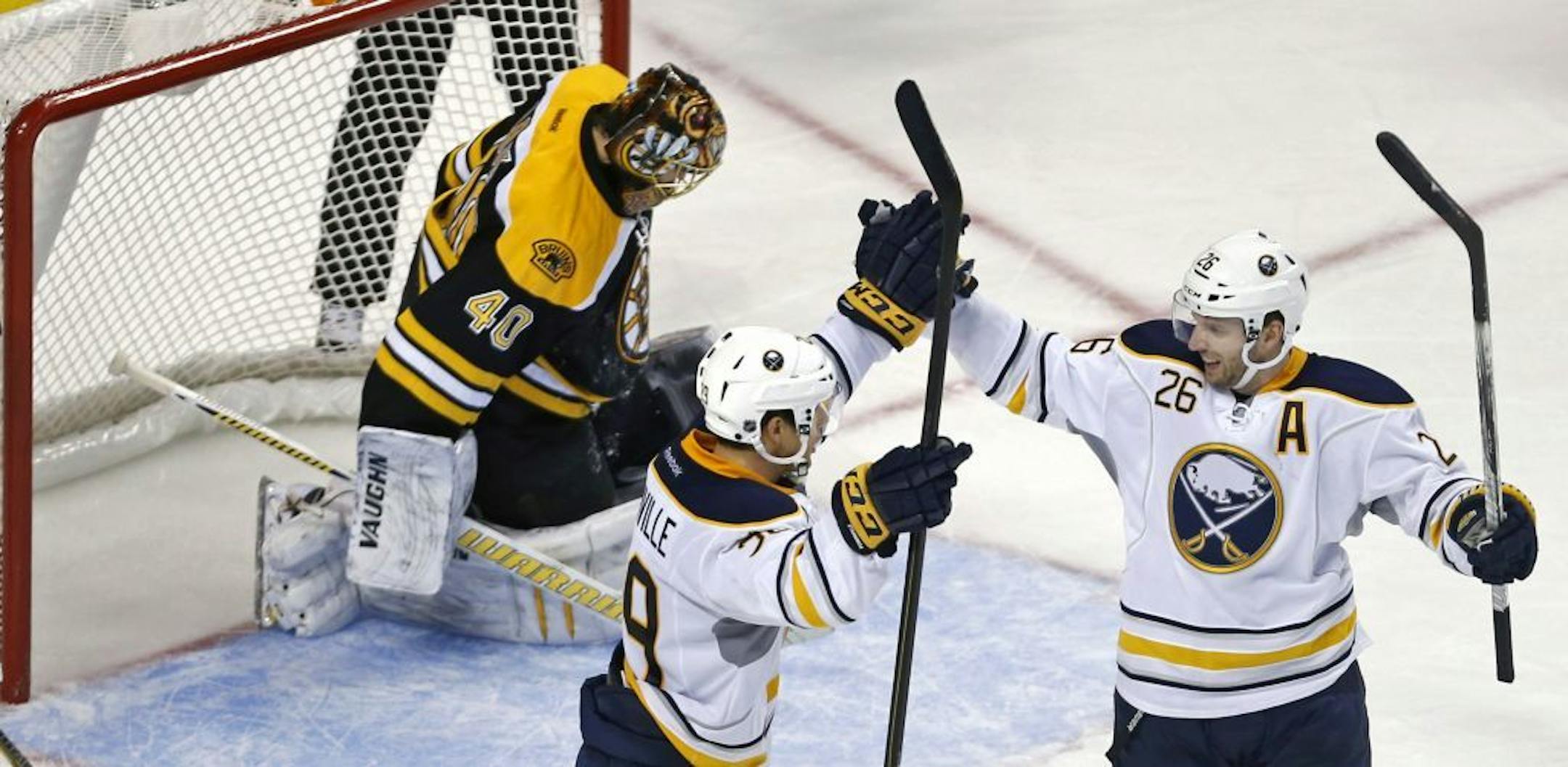 Buffalo Sabres left wing Thomas Vanek, right, of Austria, is congratulated by teammate Jason Pominville.