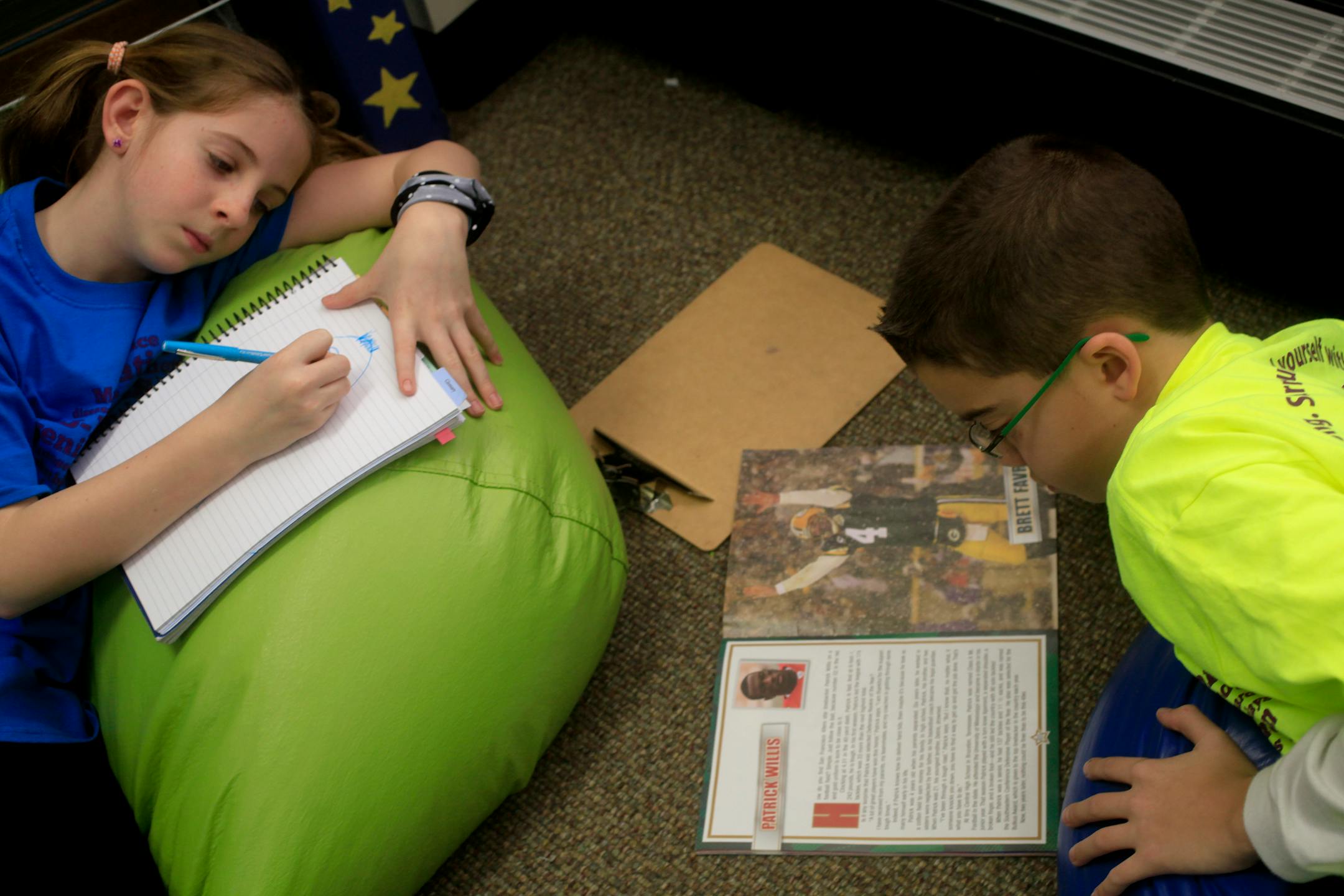 Jarrett Michie, 10, makes himself comfortable in a bean bag chair during reading time in his 5th grade class at Diamond Path School in Apple Valley, MN on January 23, 2013.