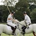 Britain's Duke of Cambridge, Prince William, left, and Prince Harry during the Audi Polo Challenge charity polo match, at Coworth Park, near Ascot, En