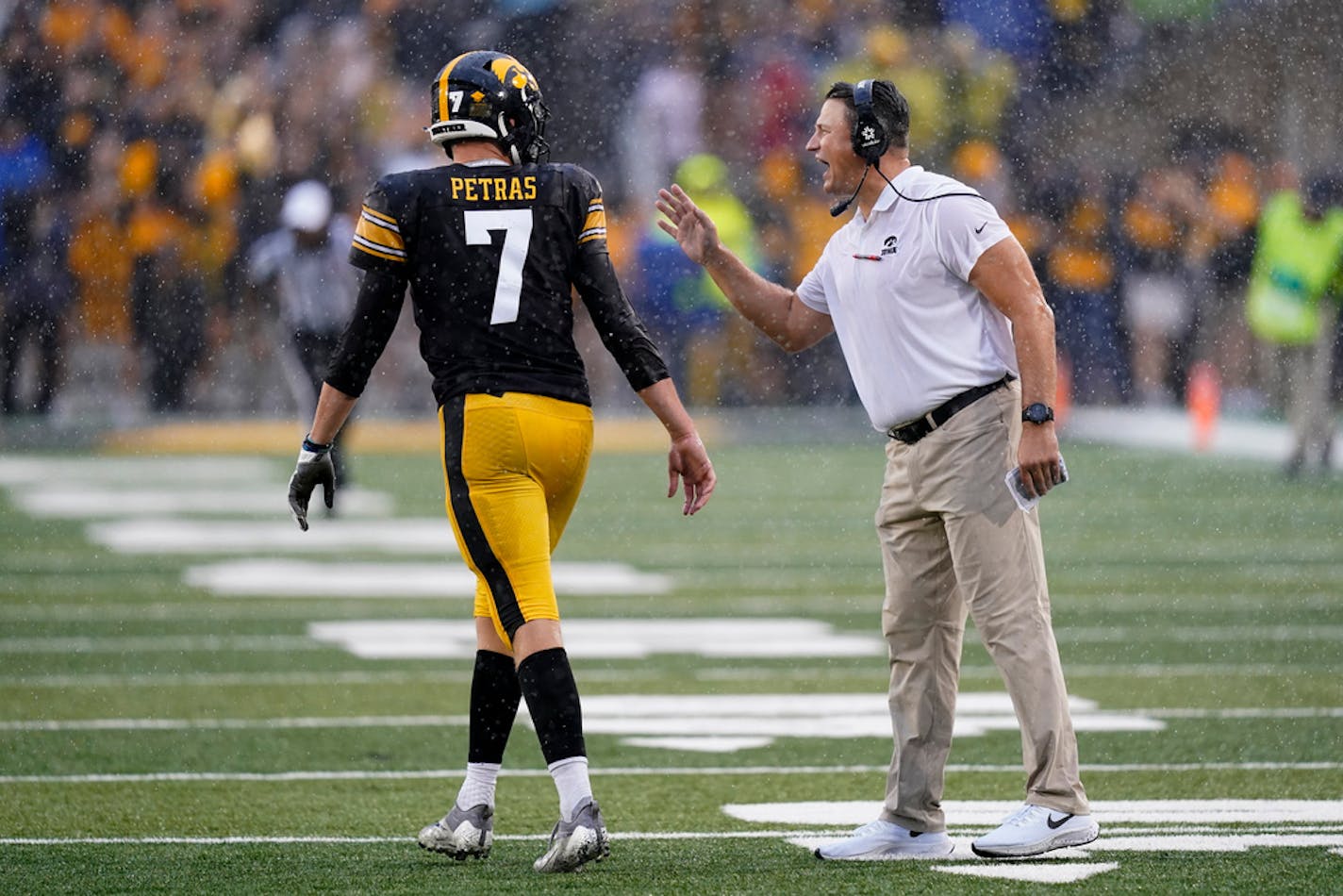 Iowa offensive coordinator Brian Ferentz talks with quarterback Spencer Petras (7) during Saturday's 10-7 loss to Iowa State.