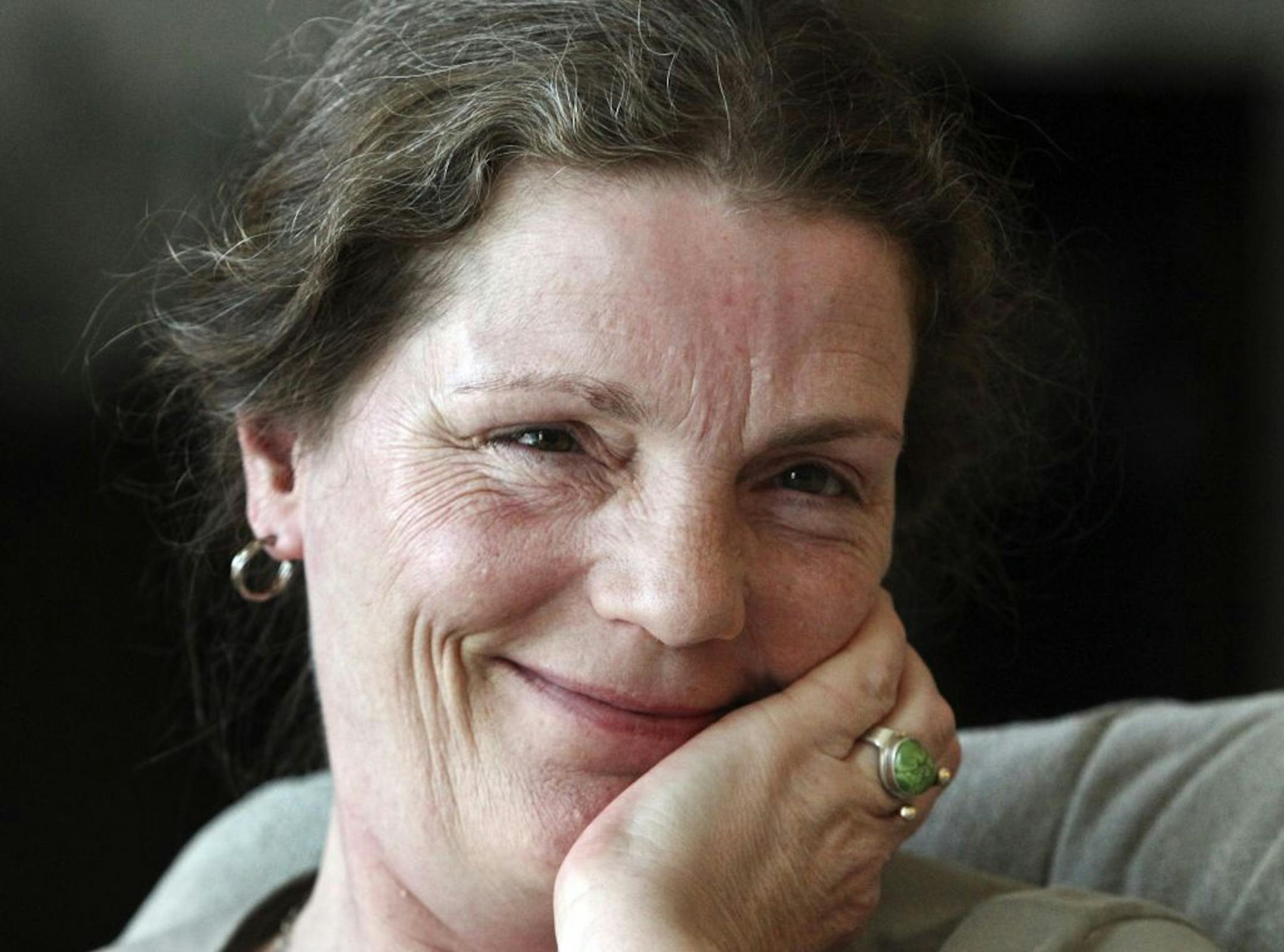 Alphie Cain, 89, got a painting from famed artist Gino Hollander as a birthday present from her daughter Eileen, seen here, who tracked down the artist and agreed to quit smoking and use the savings from that to buy the painting for $2,000 - a deep discount from his original asking price of $10,000. Cain is the mother of 17 children. "They didn't all come at once," she said.