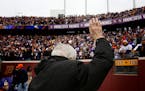 Star Tribune sports columnist Sid Hartman waved to the crowd after blowing the Gjallarhorn before the Vikings vs. Bears game at TCF Bank Stadium on De
