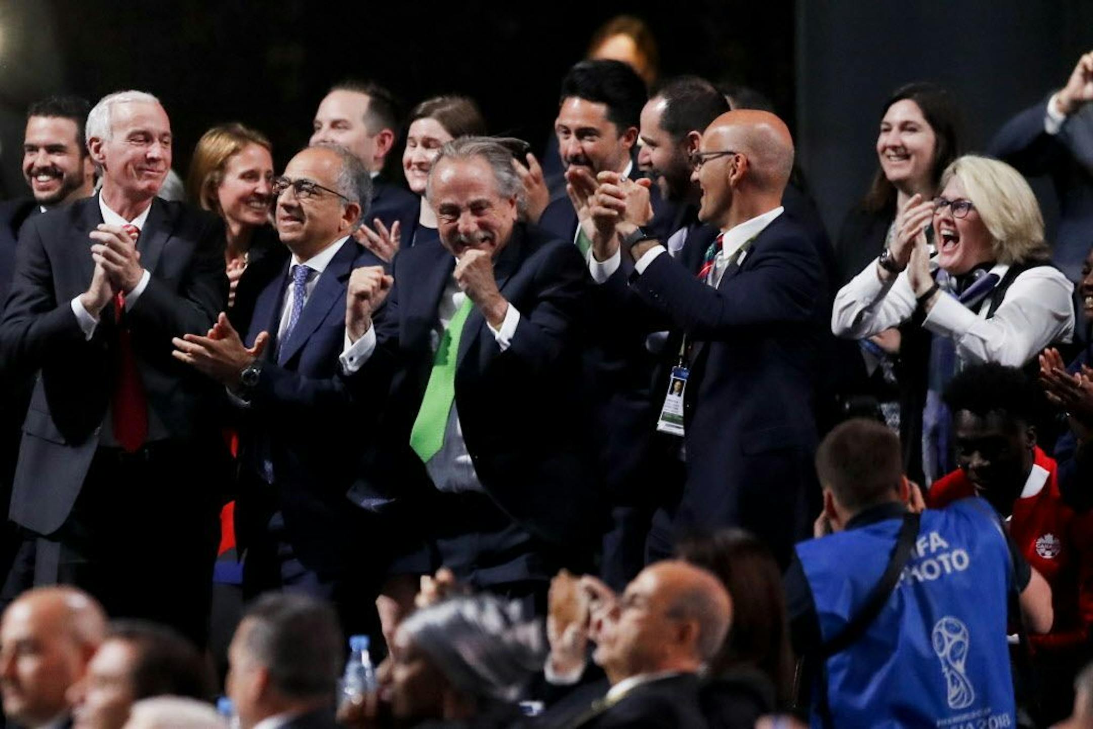 Delegates of Canada, Mexico and the United States celebrate after winning a joint bid to host the 2026 World Cup at the FIFA congress in Moscow, Russia, Wednesday, June 13, 2018. Standing on front row from left: Steve Reed, president of the Canadian Soccer Association, Carlos Cordeiro, U.S. soccer president and Decio de Maria, President of the Football Association of Mexico.