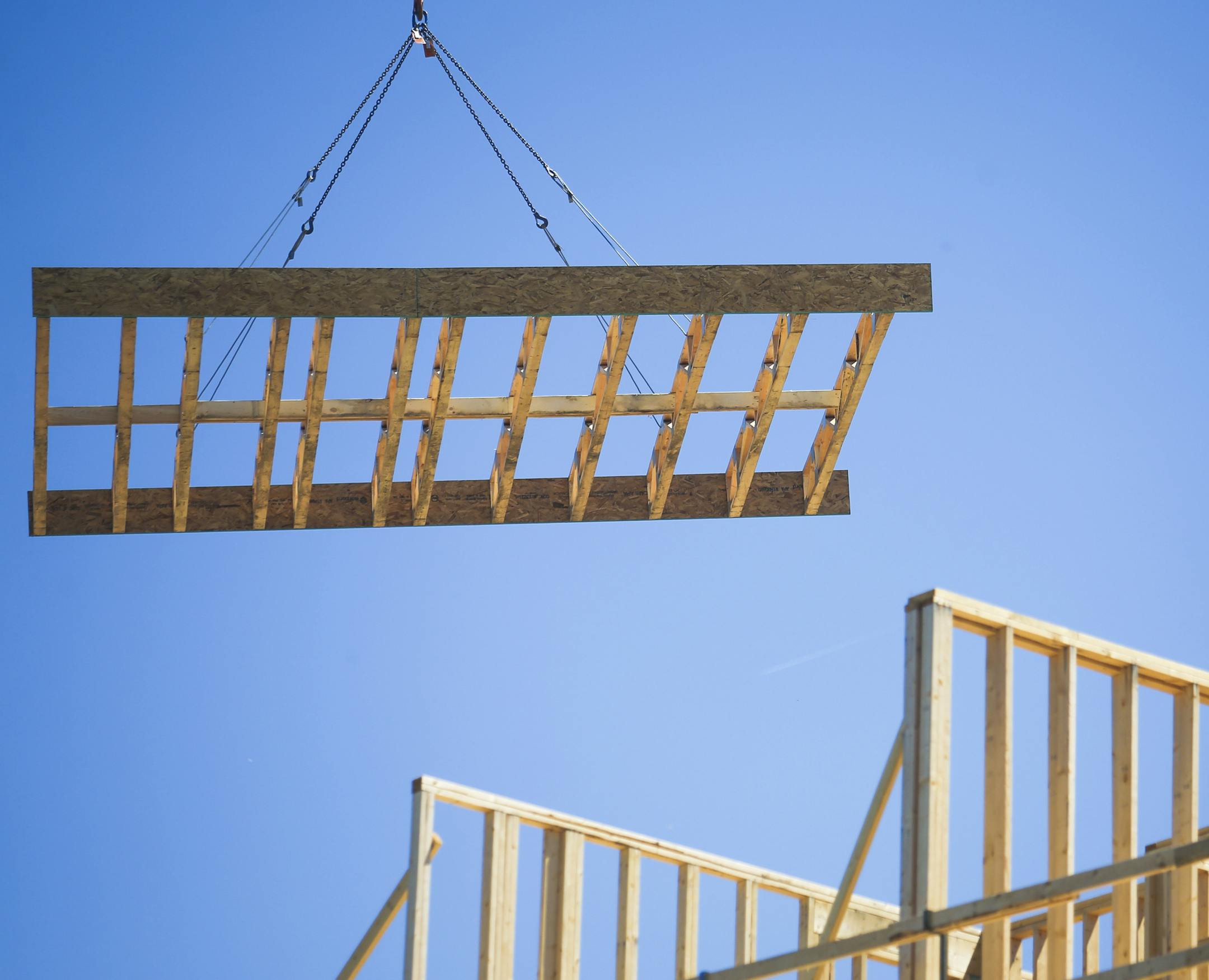 Wood paneling is brought up by a crane to the top level of Hello Apartments. ] Timothy Nwachukwu &#x2022; timothy.nwachukwu@startribune.com Construction work of Hello Apartments is performend on Friday, July 22, 2016. Though the apartment building is scheduled to be completed by December 2016, regulators are exploring whether substandard wood is being used.