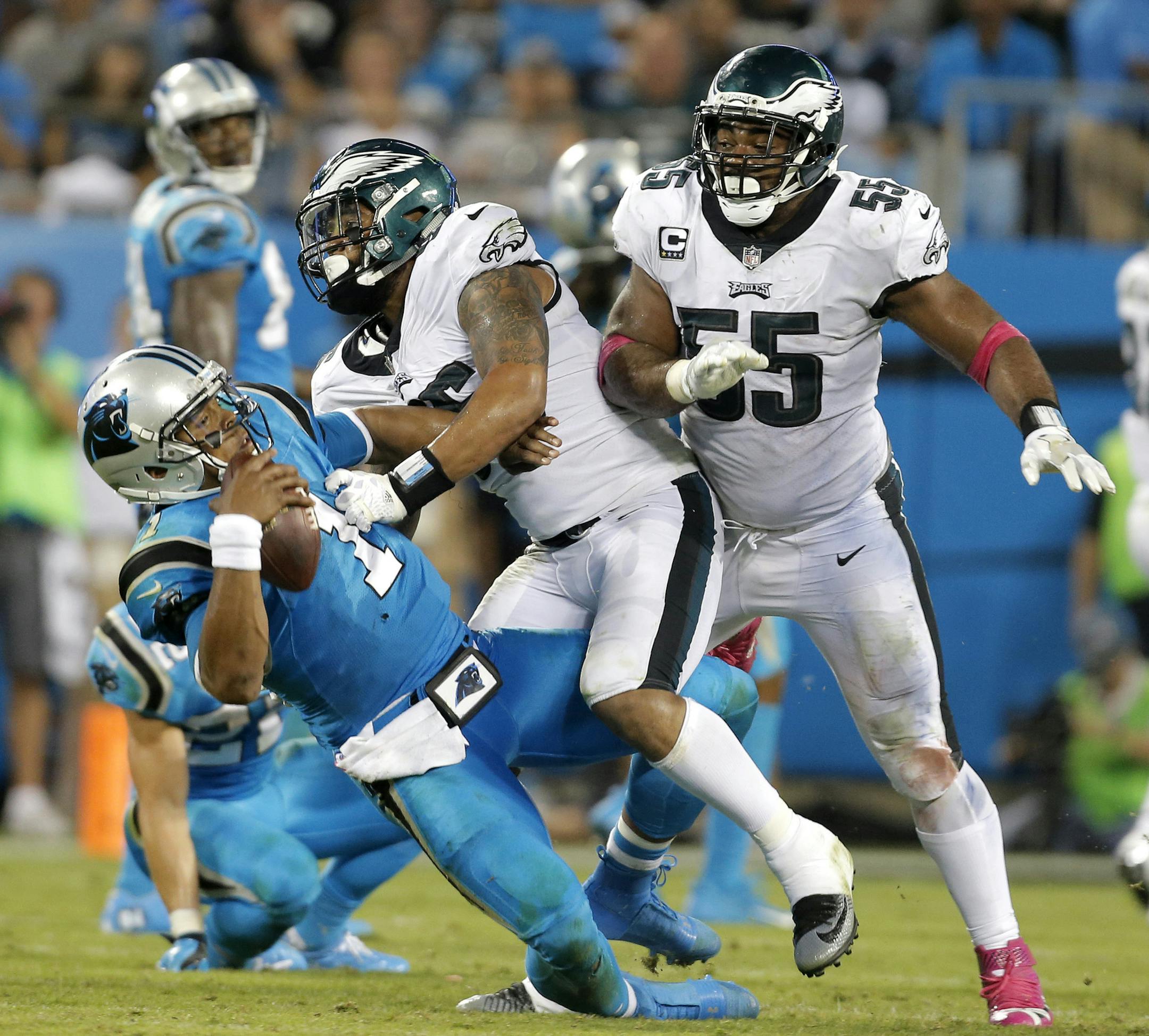 Carolina Panthers' Cam Newton (1) is hit by Philadelphia Eagles' Brandon Graham (55) and Derek Barnett (96) in the second half of an NFL football game in Charlotte, N.C., Thursday, Oct. 12, 2017. (AP Photo/Bob Leverone) ORG XMIT: NCCB133