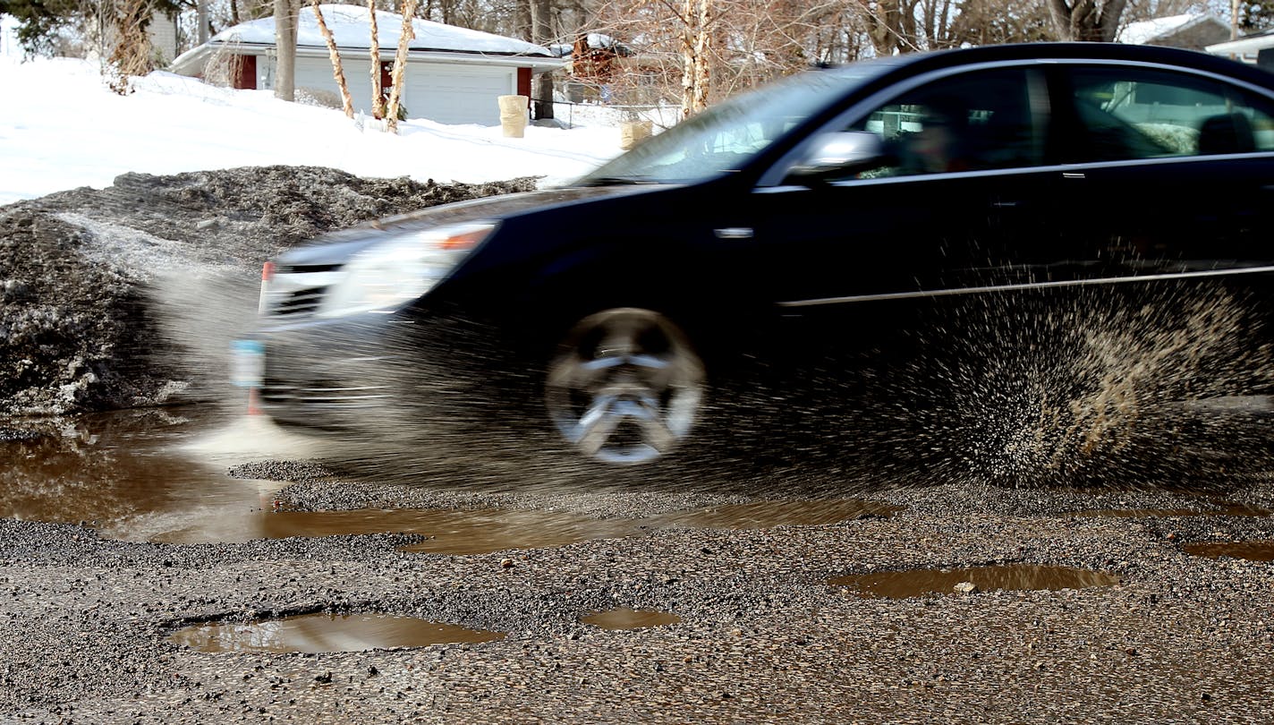 Motorist tried to avoid potholes in south Minneapolis. These large pothole can be fond on Xerxes Avenue South between 56th and 57th street South in Minneapolis, MN. ] JOELKOYAMA&#x201a;&#xc4;&#xa2;jkoyama@startribune Minneapolis, MN on March 10, 2014.