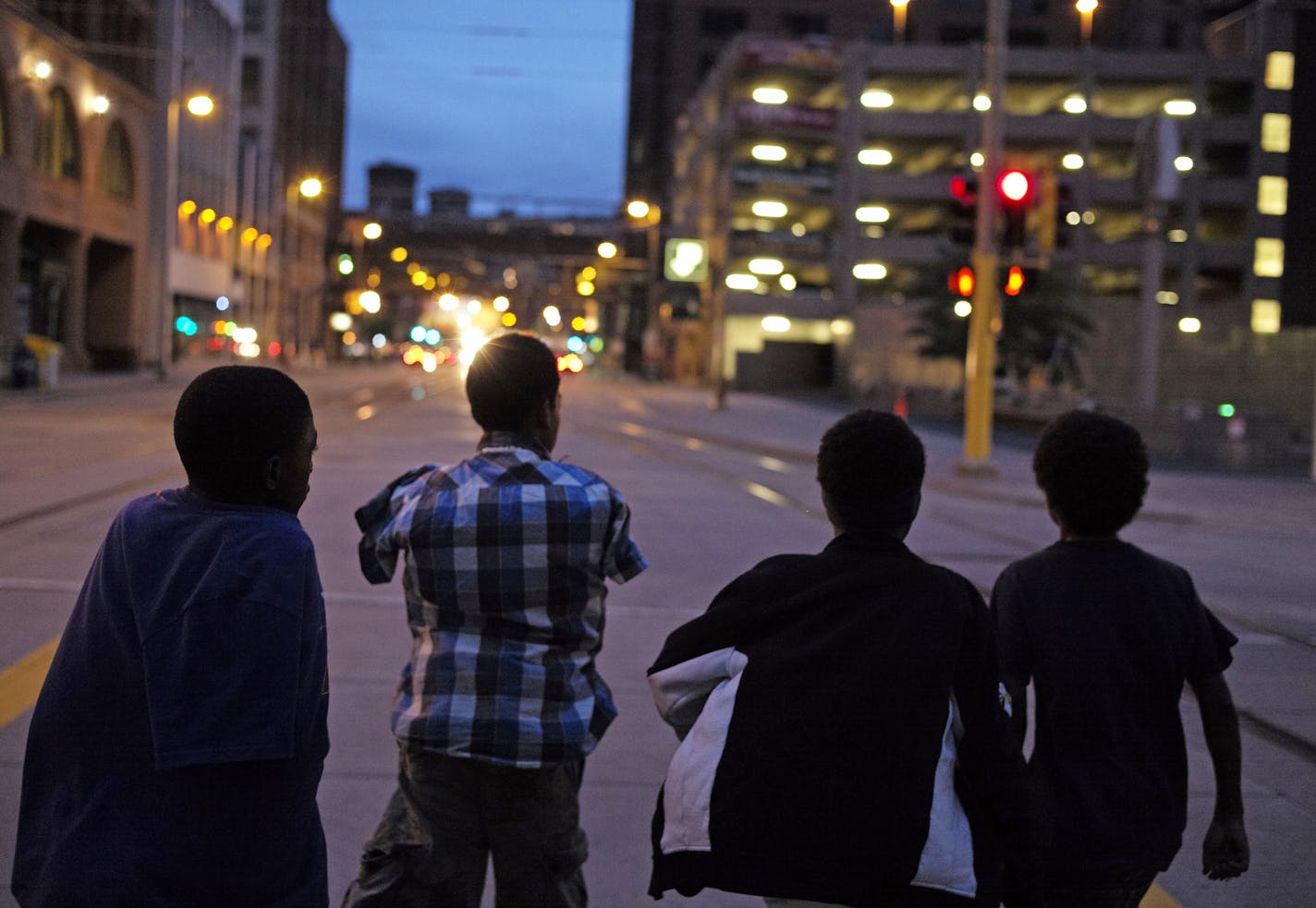 In downtown, a Minneapolis On July 1, 2014, a group of teenagers Antwon Seamon, Dapri Hallom, JoJo Knight, and Jay Young, left to right, who all claimed to be 13 or older were wandering the streets a little after nine o'clock. They would not be breaking curfew if their stated age is correct] rtsong-taatarii@startribune.com