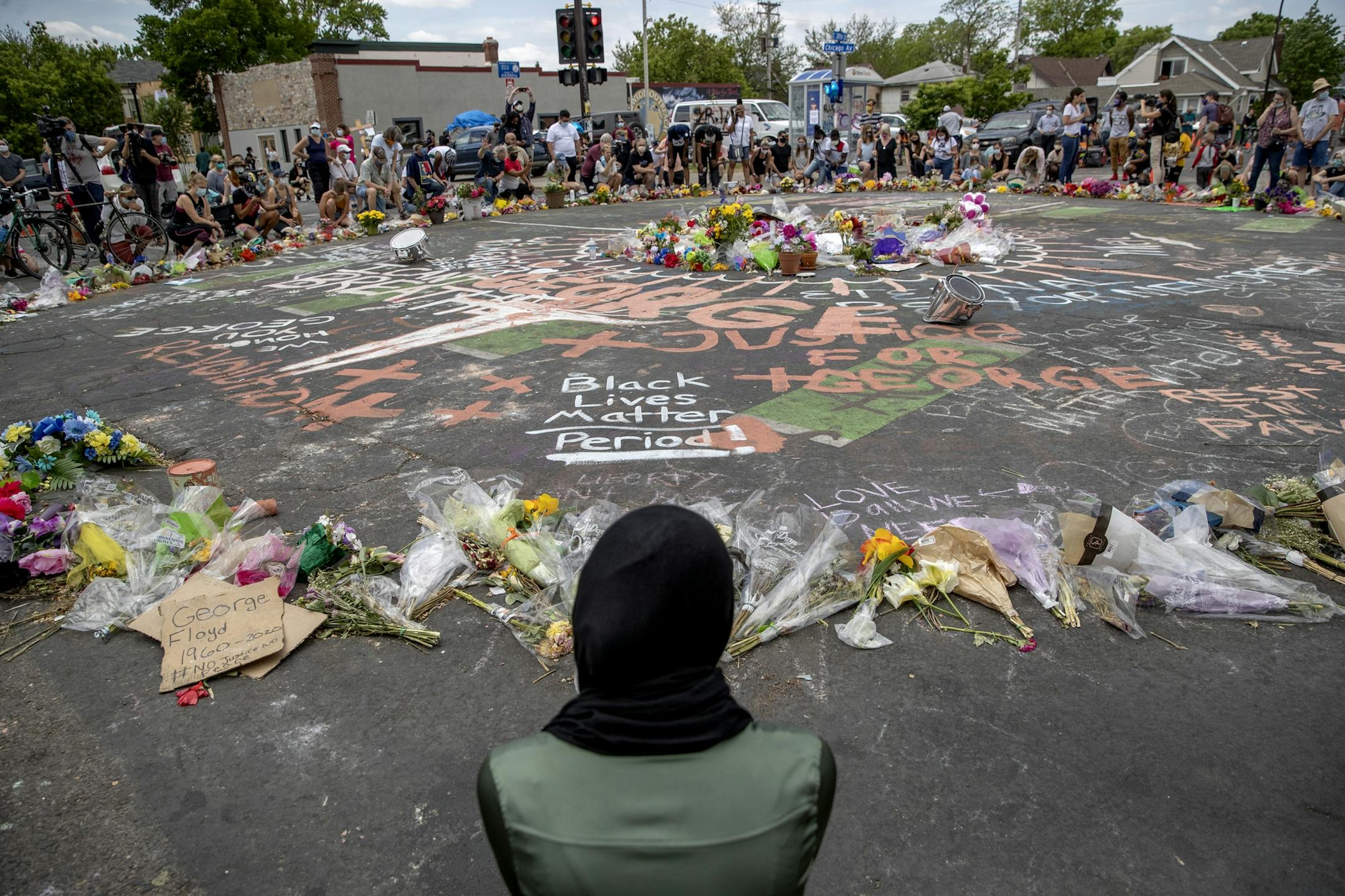 Just minutes before Terrence Floyd arrived, people gathered for prayer and got down on a knee for 9 minutes, marking the time the officer was on George Floyd, at the scene where he was killed, Monday, June 1, 2020 in Minneapolis, MN.