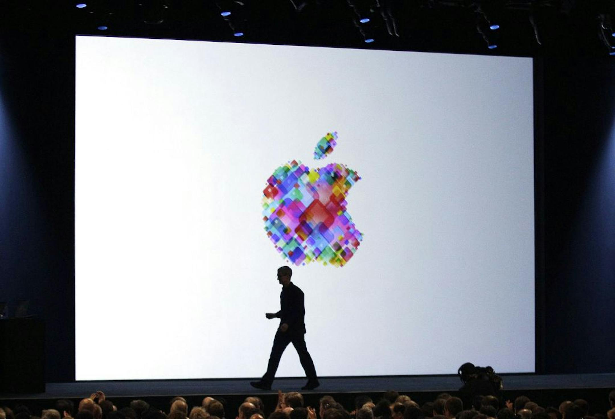 Apple CEO Tim Cook walked on stage during the Apple Developers Conference in San Francisco in June. As makers of consumer electronics refresh their products for the holiday shopping season, Apple's rivals are hoping that a head start on the new-phone buzz will translate into stronger sales.