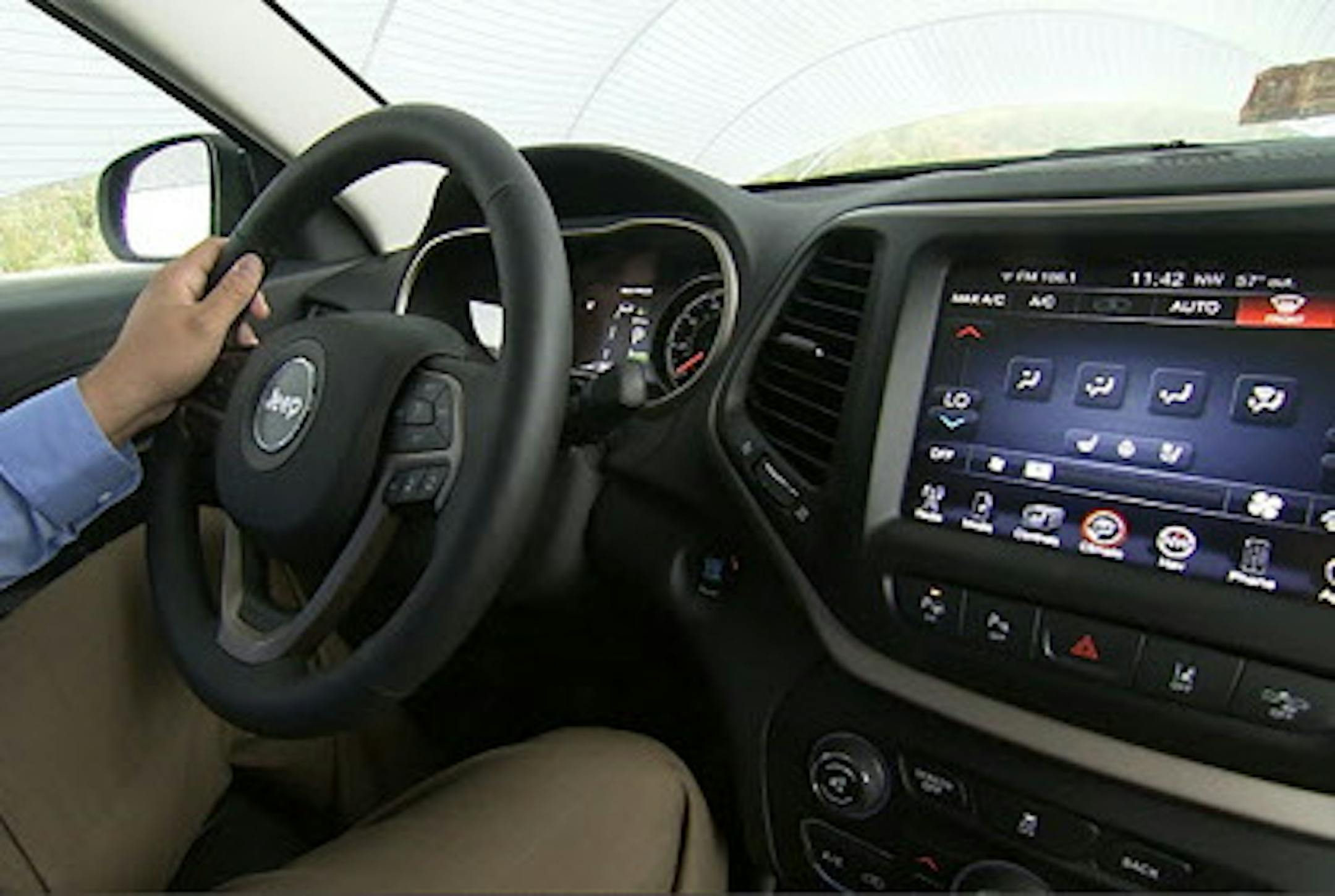 This image from video, taken Oct. 1, 2015, shows Insurance Institute for Highway Safety (IIHS) Senior Research Engineer David Aylor in the drivers seat with an electronic display on the dashboard at the IIHS Vehicle Research Center in Ruckersville, Va. American car buyers are baffled by a blizzard of new safety technologies in vehicles that vary from manufacturer to manufacturer, from model to model, and from one options package to another. (AP Photo/Dan Huff)