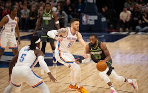 Timberwolves guard Mike Conley drives against Thunder forward Isaiah Hartenstein during a February meeting at Target Center.
