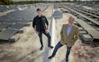 Griffin Dooling of Blue Horizon Energy, left, and founder Christopher Wyffels of Superior Companies, stood on the roof of Superior, a warehouse and lo
