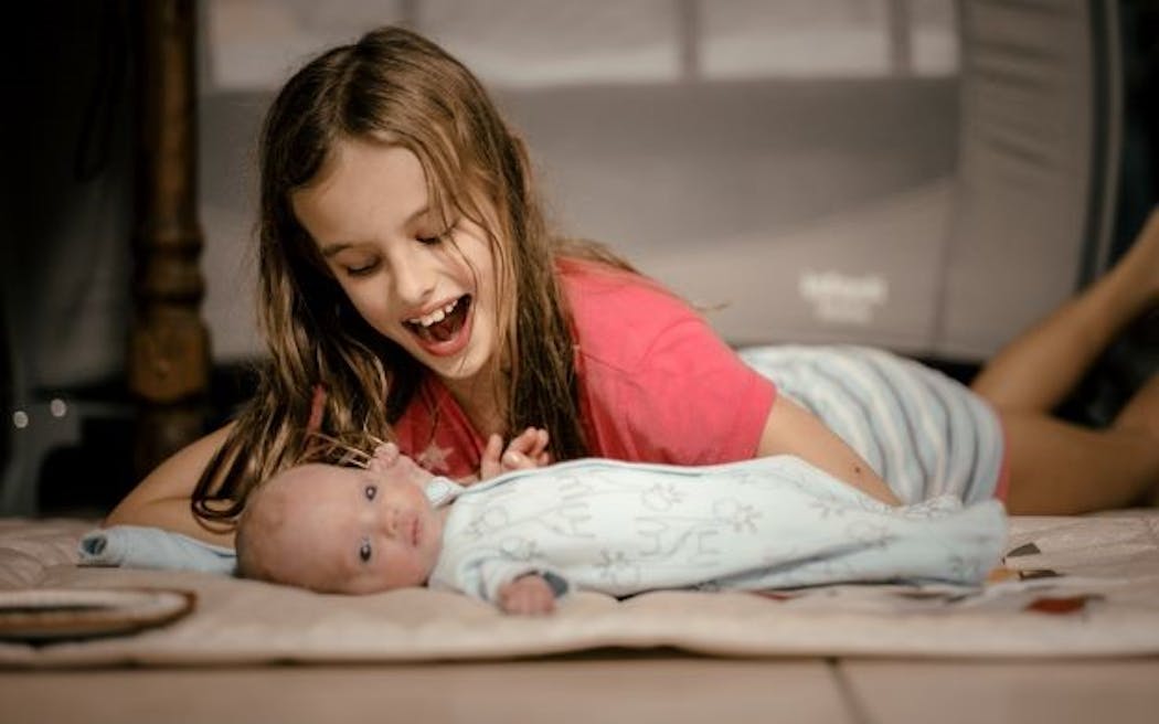 Greyson Leo Phillips, two months old, spends time with his 8-year-old sister, Melory, in Florianópolis, Brazil last week.