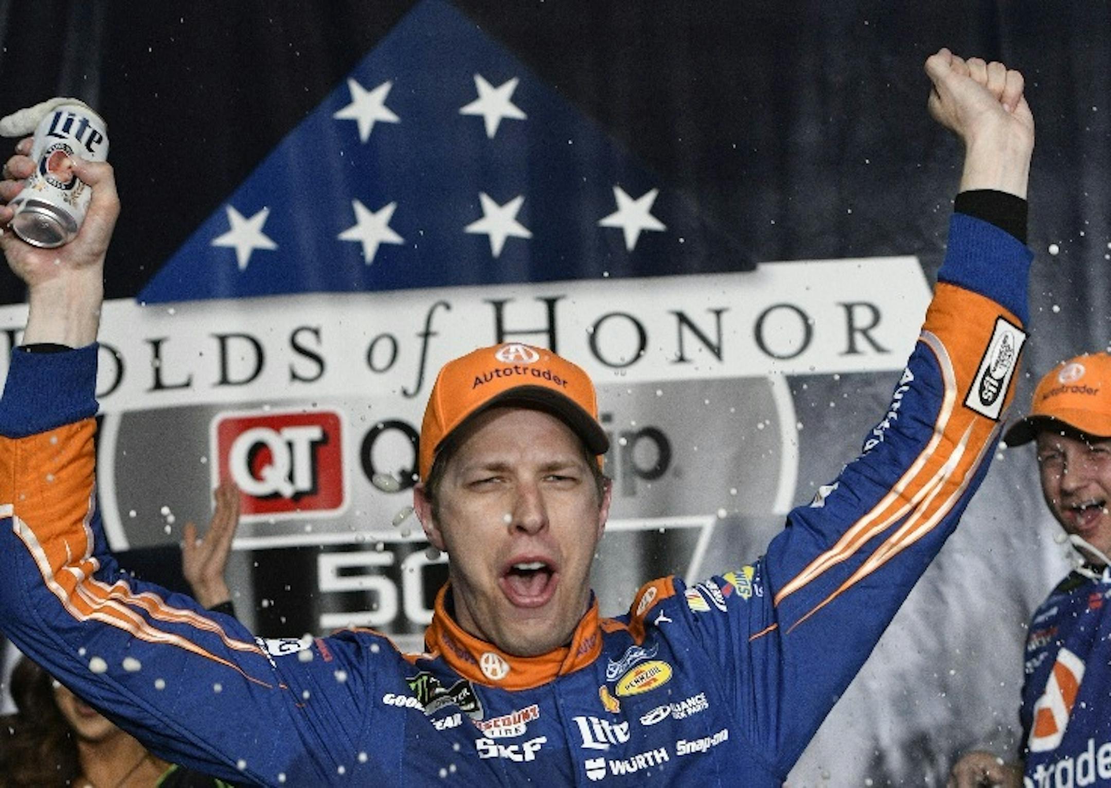 Brad Keselowski celebrated in Victory Lane after winning a NASCAR Monster Cup series auto race at Atlanta Motor Speedway in Hampton, Ga., on Sunday.