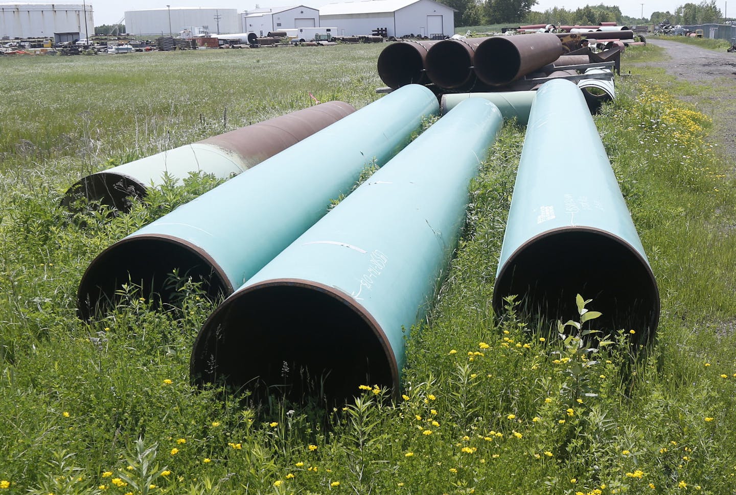 FILE - In this June 29, 2018, file photo, pipeline used to carry crude oil is shown at the Superior, Wis., terminal of Enbridge Energy. A significant permit has been granted to Enbridge's plan to replace its aging Line 3 oil pipeline across northern Minnesota.