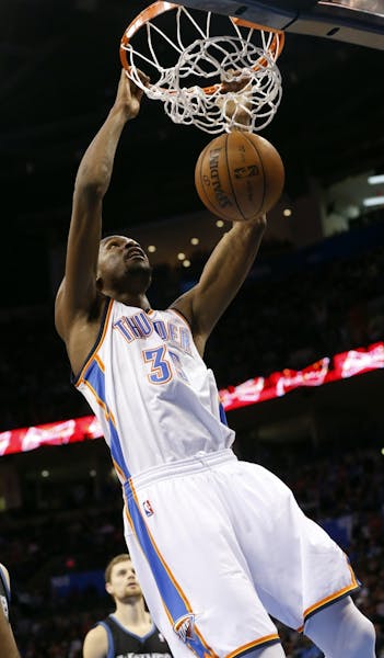 Oklahoma City Thunder forward Kevin Durant (35) dunks against the Minnesota Timberwolves in the fourth quarter of an NBA basketball game in Oklahoma C