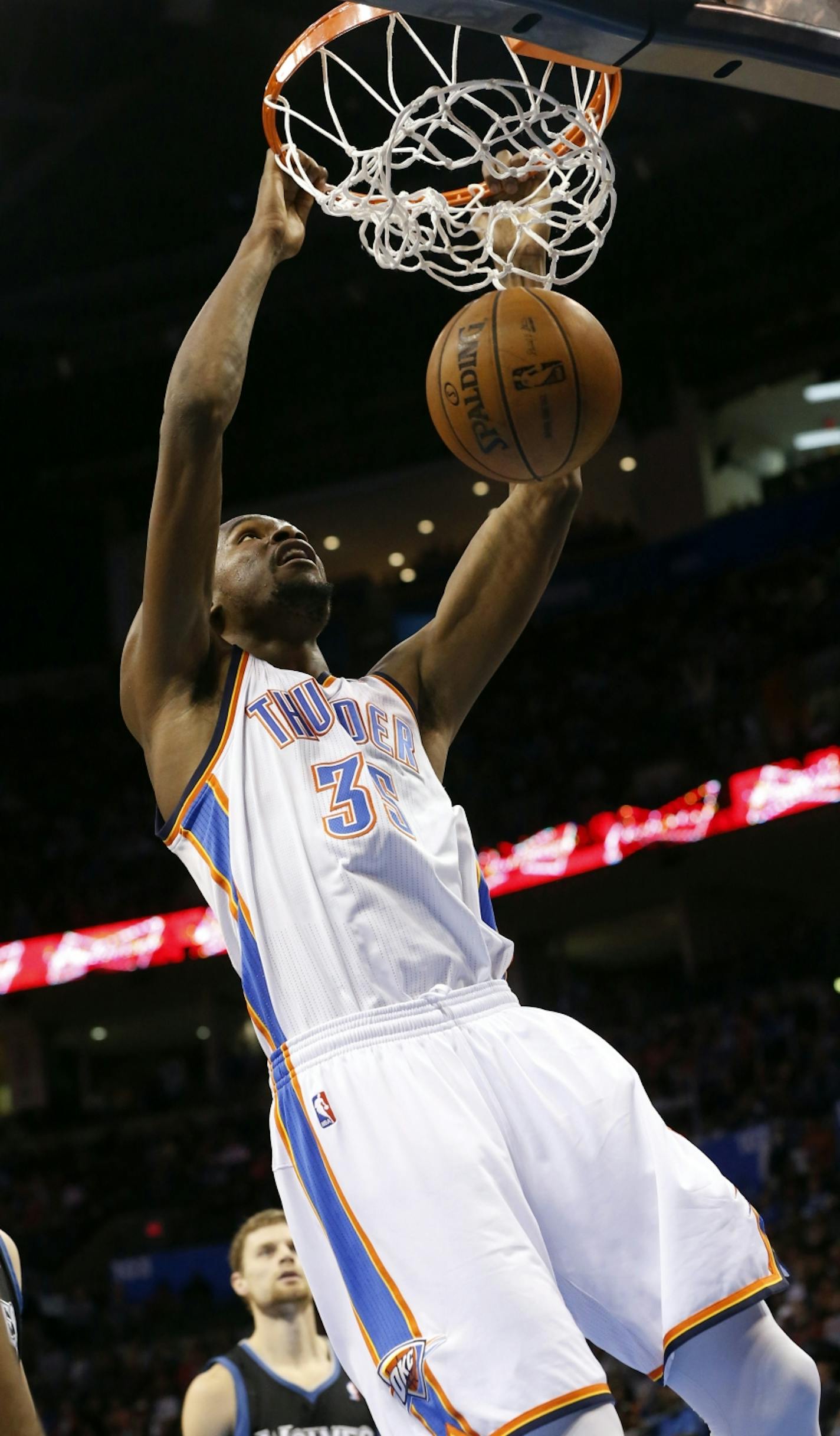 Oklahoma City Thunder forward Kevin Durant (35) dunks against the Minnesota Timberwolves in the fourth quarter of an NBA basketball game in Oklahoma City, Wednesday, Jan. 9, 2013. Oklahoma City won 106-84.