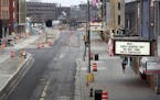 Traffic and pedestrians along Hennepin Avenue in downtown Minneapolis were few on Wednesday as state health officials continue to ask people to stay h