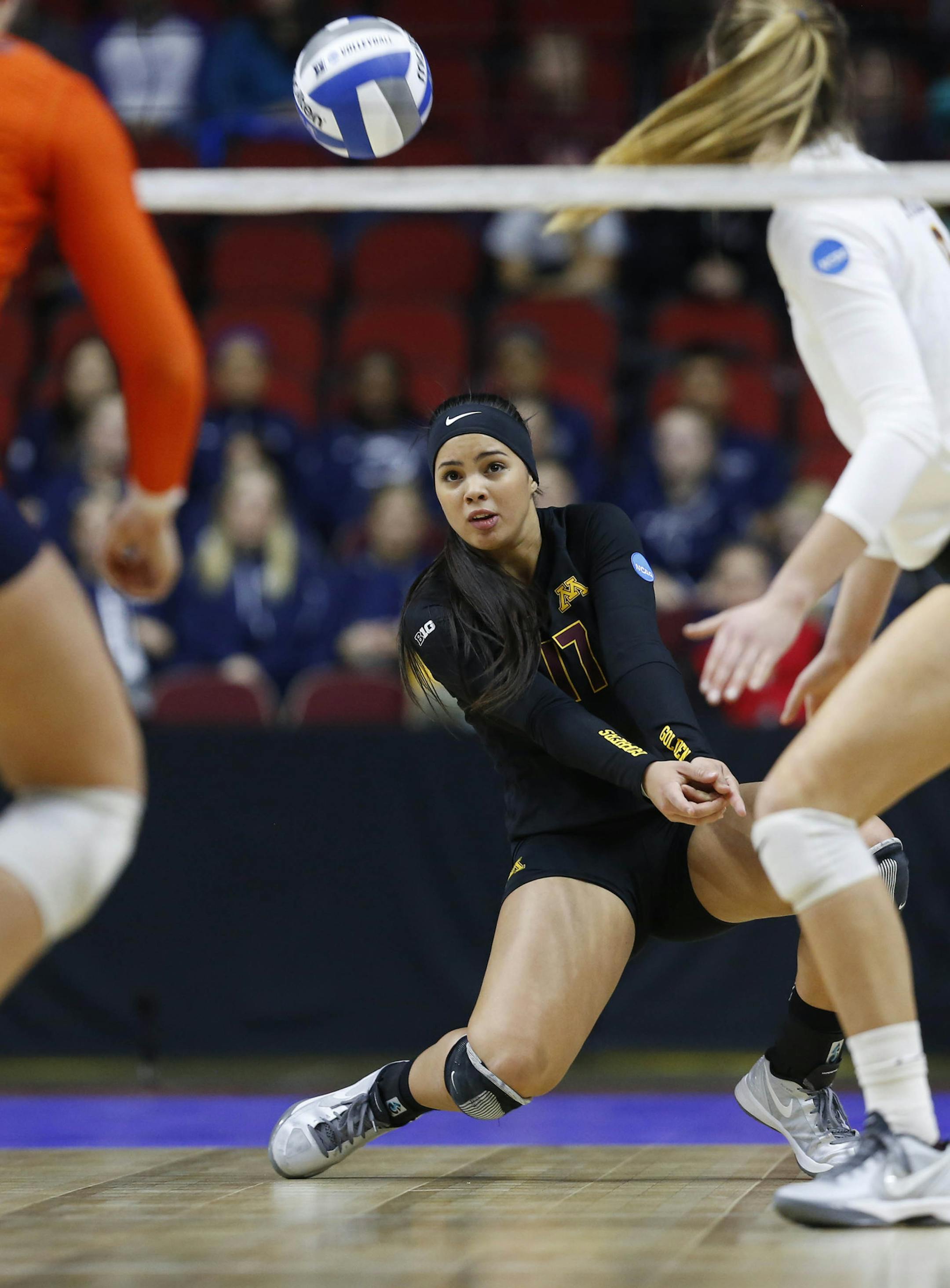 Minnesota's Dalianliz Rosado (17) knocks back the ball to Illinois during an NCAA college volleyball game, Friday, Dec. 11, 2015 in Des Moines, Iowa. (Michael Zamora/The Des Moines Register via AP) MAGS OUT, TV OUT, NO SALES, MANDATORY CREDIT