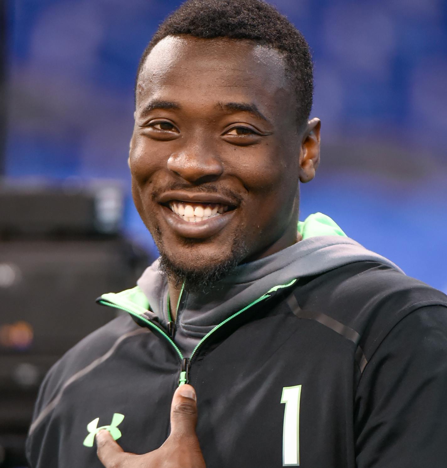 Clemson defensive back Mackensie Alexander laughs while watching players workout at the NFL football scouting combine, Monday, Feb. 29, 2016, in Indianapolis. (AP Photo/L.G. Patterson)