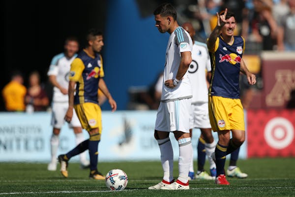 Minnesota United forward Christian Ramirez (21) waited for play to resume after the New York Red Bulls scored their second goal of the game in the sec