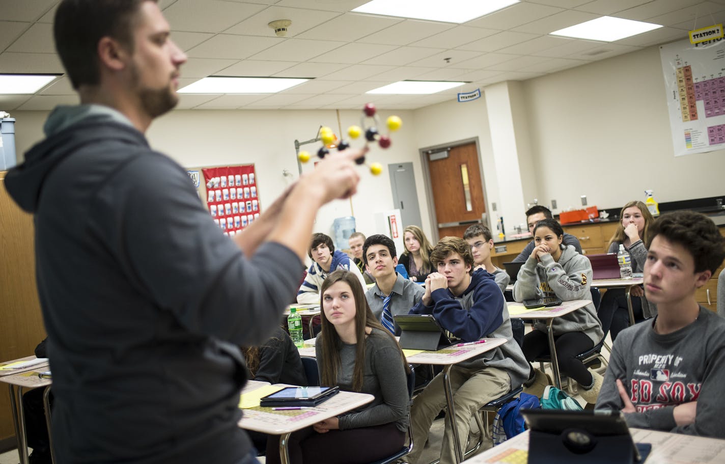 Students in Mr. Ben Froehling's chemistry class paid attention to his lecture late in Tuesday's school day. ] (AARON LAVINSKY/STAR TRIBUNE) aaron.lavinsky@startribune.com Wayzata public schools became the latest Minnesota district to "flip" start times so that high school students can sleep later and grade-schoolers get on the bus earlier. The vote came at an emotional meeting that reflected divisions among parents over academic quality, family time and busy working parents. Advocates say these