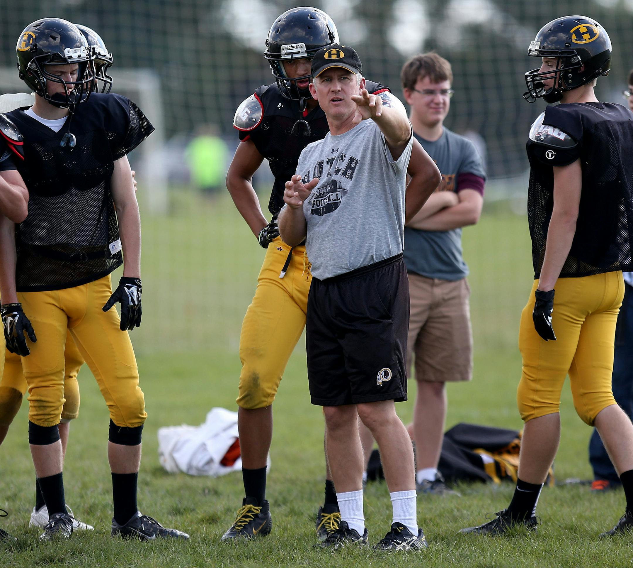 Hutchinson's head coach Andy Rostberg talked to his players during practice. ] (KYNDELL HARKNESS/STAR TRIBUNE) kyndell.harkness@startribune.com Hutchinson football practice in Hutchinson Min., Wednesday, September 17, 2014.