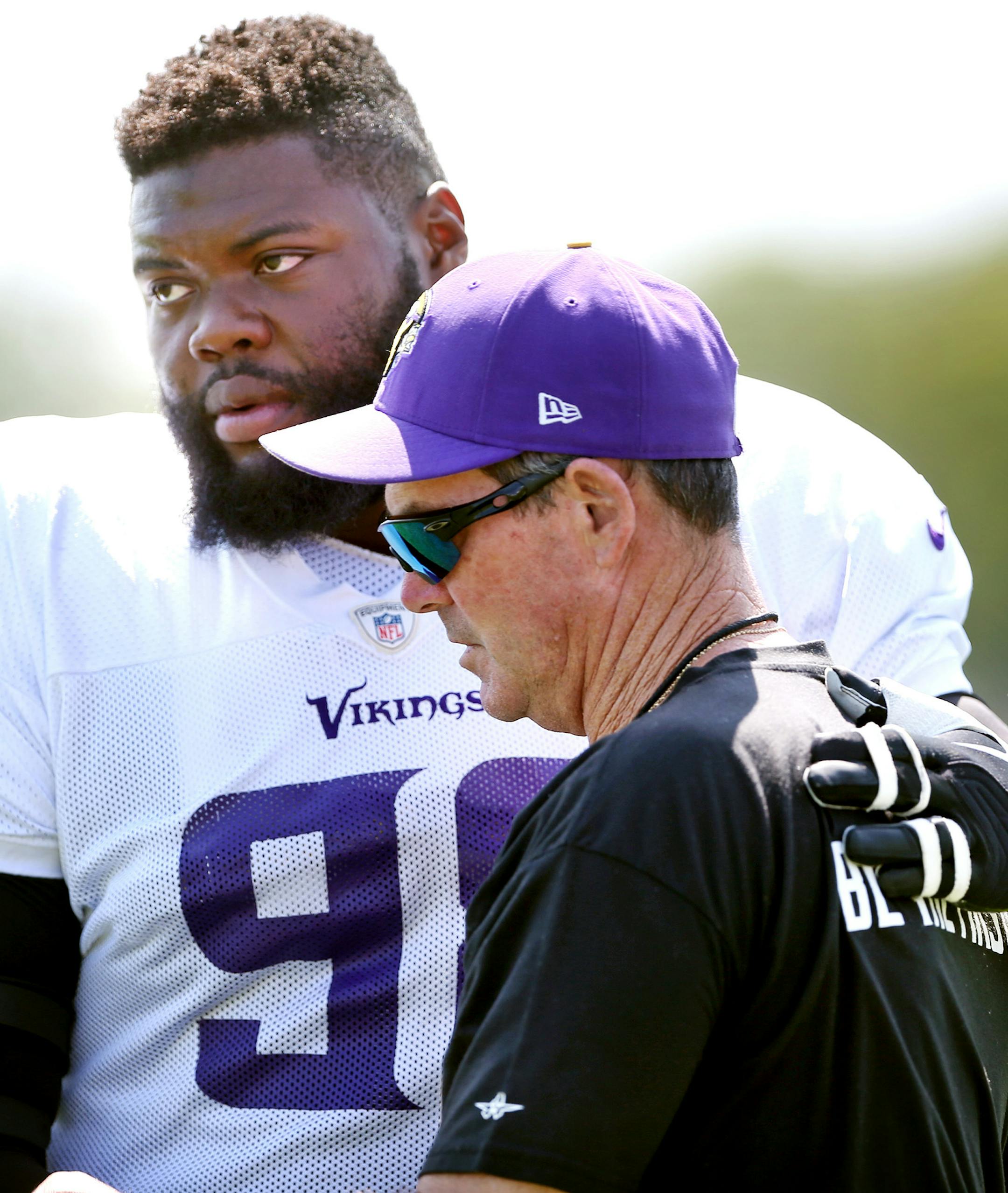 Vikings tackle Linval Joseph hugged head coach Mike Zimmer at Minnesota State University Mankato Wednesday August 12, 2015 in Mankato, MN. Vikings head coach Mike Zimmer's father, Bill, passed away on Tuesday in Naples, Fla. He was 84. ] Jerry Holt/ Jerry.Holt@Startribune.com