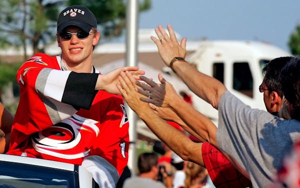 Carolina Hurricanes' Eric Staal is congratulated by a fans, Tuesday, June 20, 2006, during a parade for the hockey team in Raleigh, N.C. The Hurricane