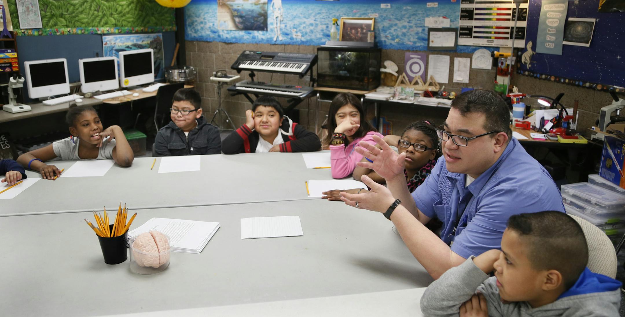 Benjamin Kimmel a science at Anderson talked with his students about green energy . Andersen United school is among 13 Minneapolis schools in session during spring break prepping for sate tests and working on better academic habits April 3, 2014 in Minneapolis , MN. ]JERRY HOLT jerry.holt@startribune.com