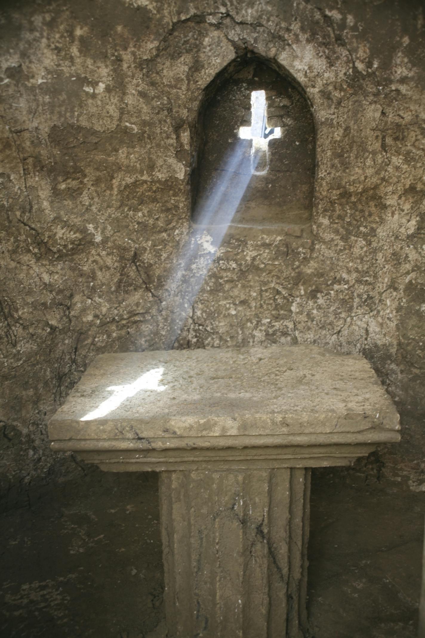 In an undated handout photo, a beam of sunlight shines through a cross-shaped window onto an alter table in a 13th century chapel at an excavation site in Turkey. The excellent condition of a newly discovered 13th-century chapel has stirred hopes among archaeologists that an entire city may be largely intact underground. (Myra-Andriake Excavations via The New York Times) -- NO SALES; FOR EDITORIAL USE ONLY WITH STORY SLUGGED SCI TURKEY EXCAVATION BY JENNIFER PINKOWSKI. ALL OTHER USE PROHIBITED.