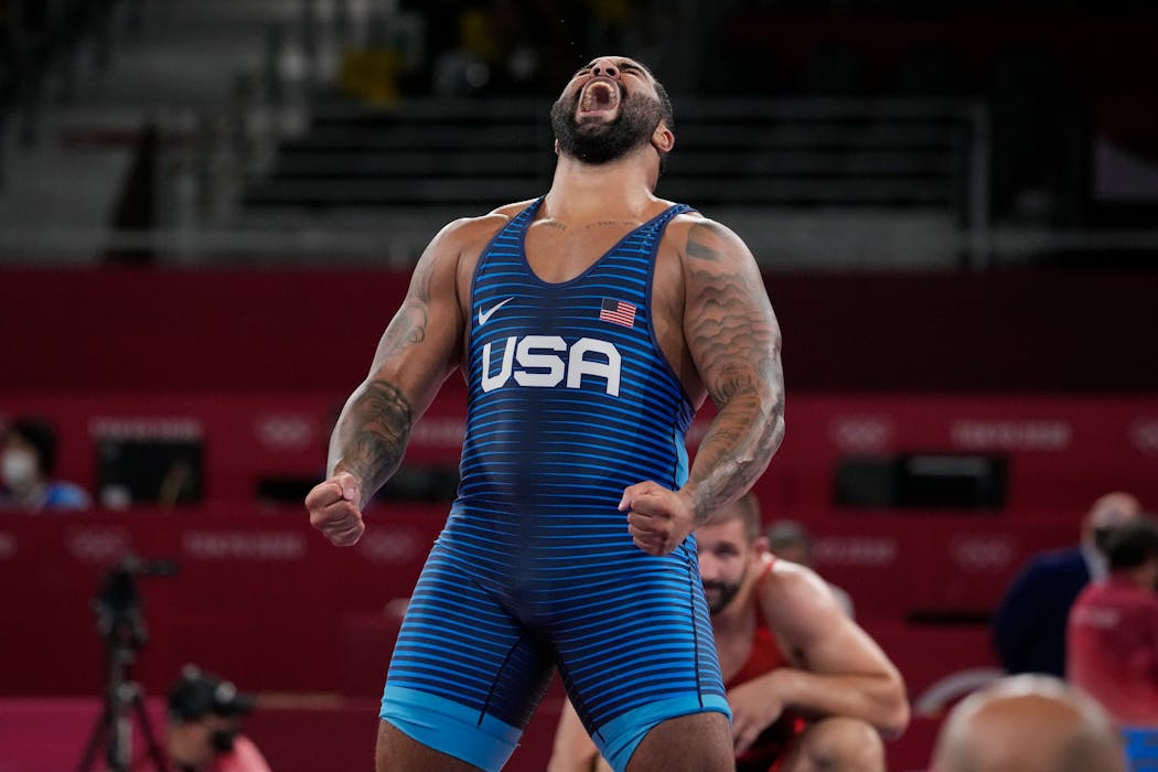 Gable Steveson celebrates after defeating Georgia’s Gennadij Cudinovic during the men’s freestyle 125kg final match at the 2020 Summer Olympics.