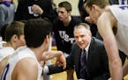 Head coach John Tauer talks to players during a time out at the men's basketball MIAC Championship game versus St. Olaf College February 28, 2016 in t